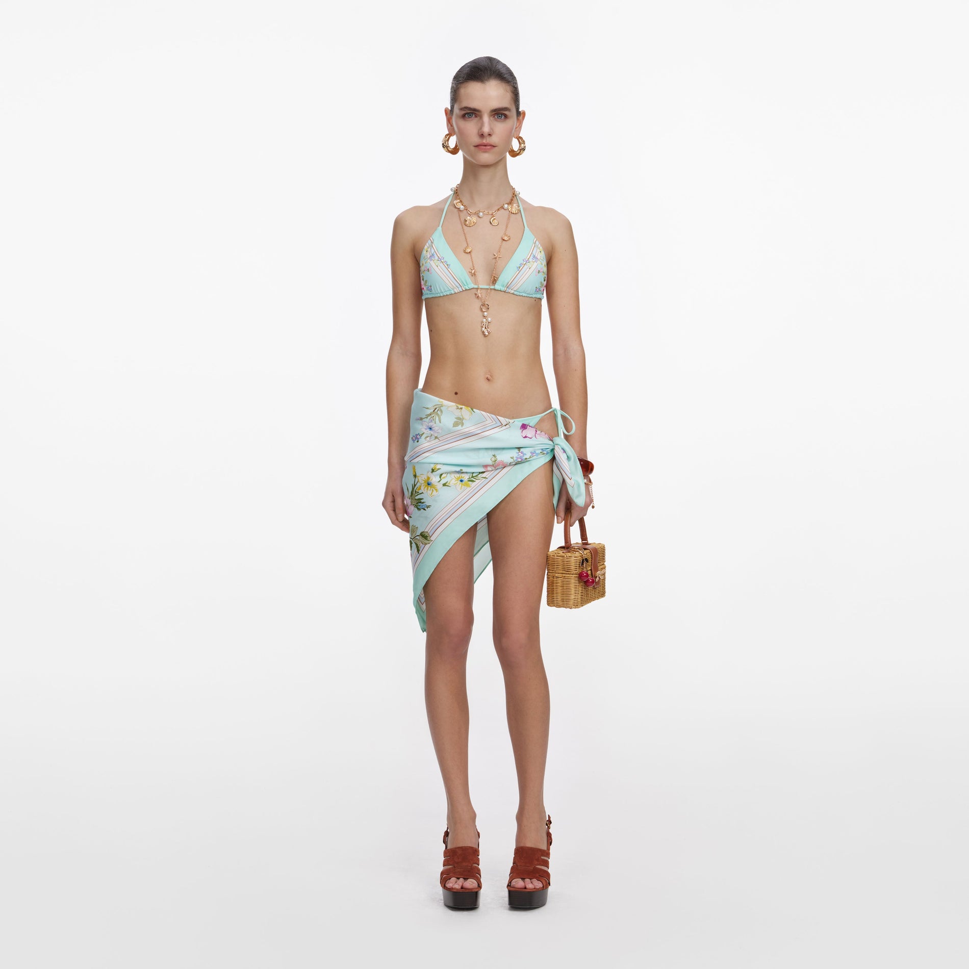 Front view of a woman wearing the Mint Floral Bikini Top