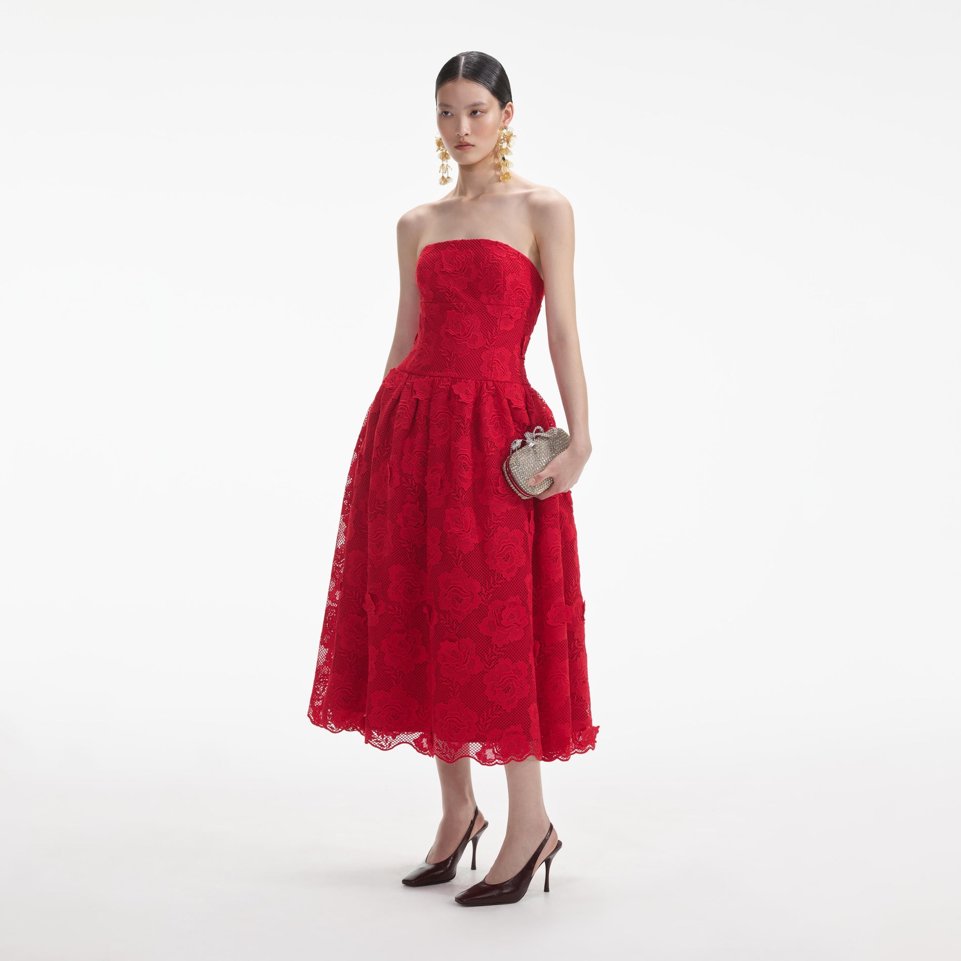 Side view of a woman wearing the Red Bandeau Lace Midi Dress