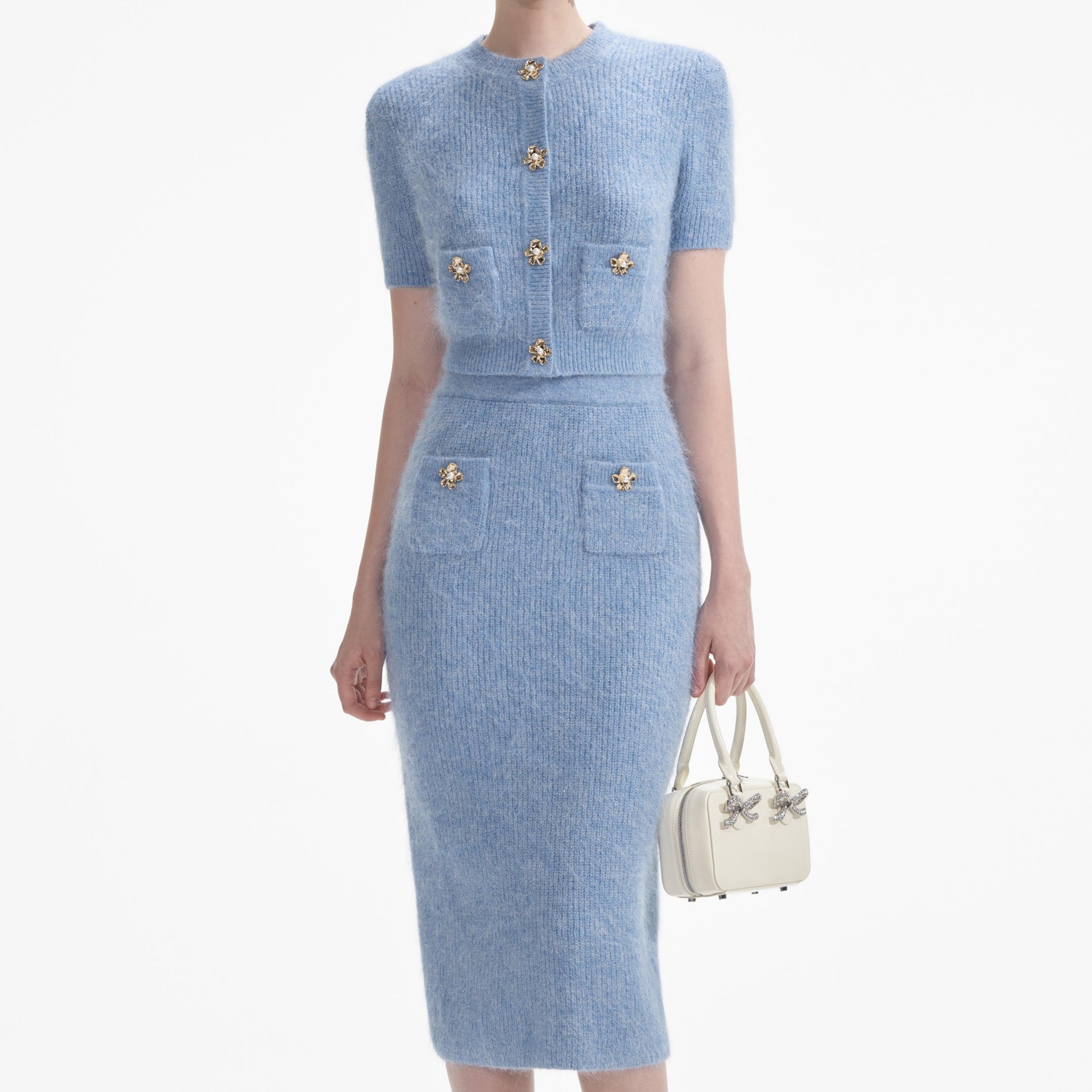 A close up of a woman wearing the Blue Soft Knit Top