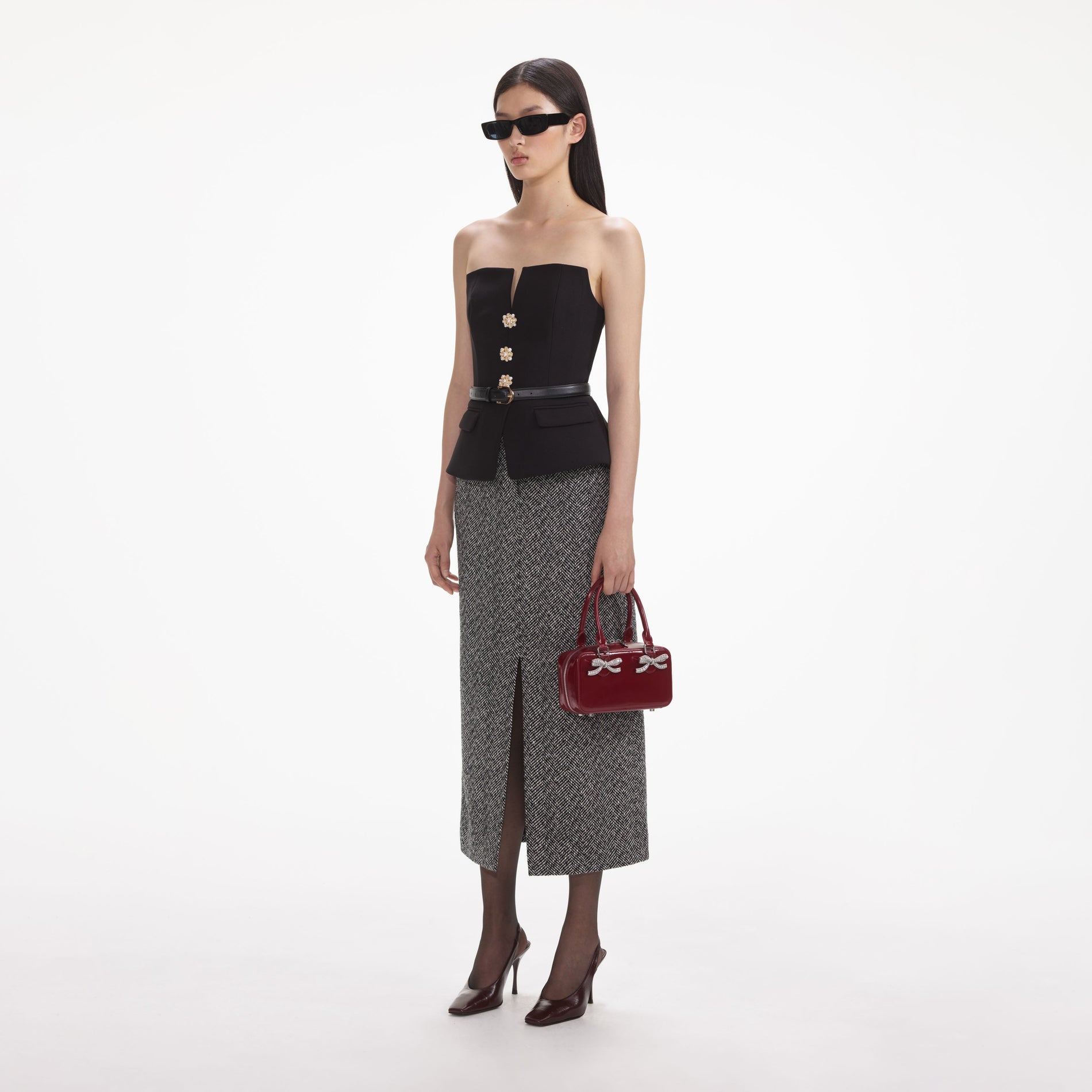 Side view of a woman wearing the Black Crepe Bandeau Top