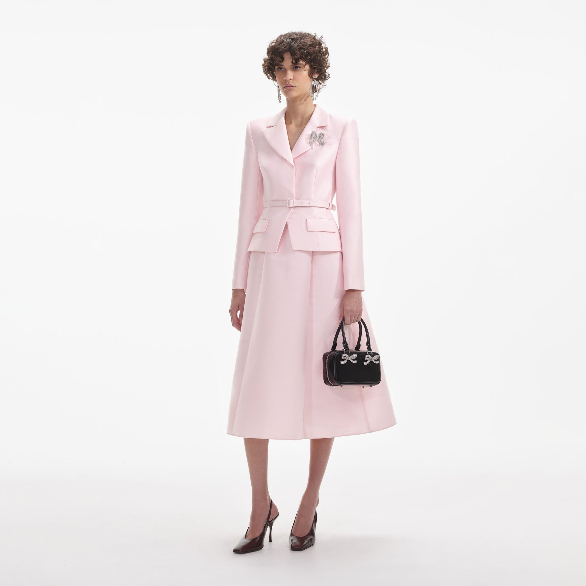 Side view of a woman wearing the Pink Tailored Taffeta Midi Dress