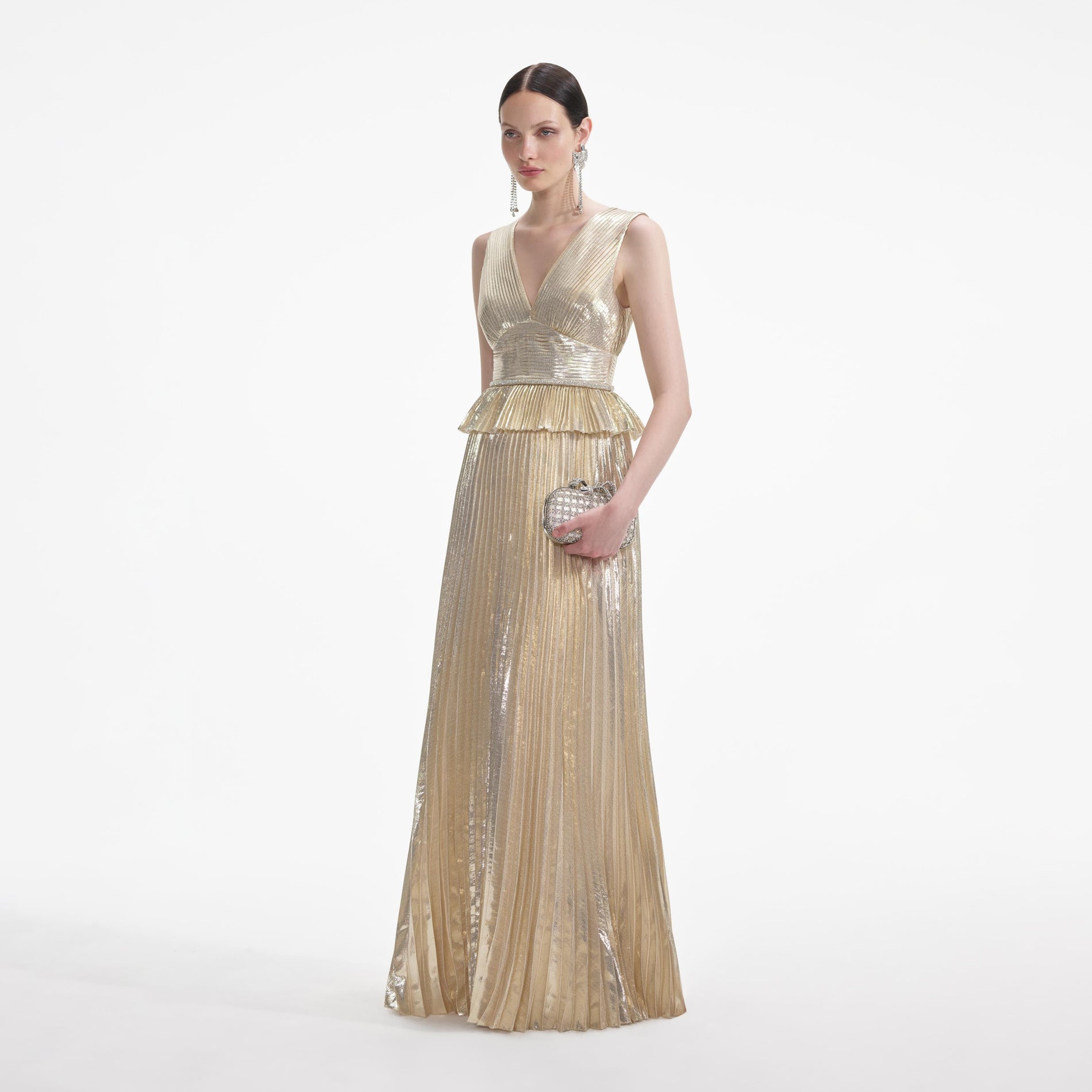 Side view of a woman wearing the Gold Metallic V-Neck Maxi Dress