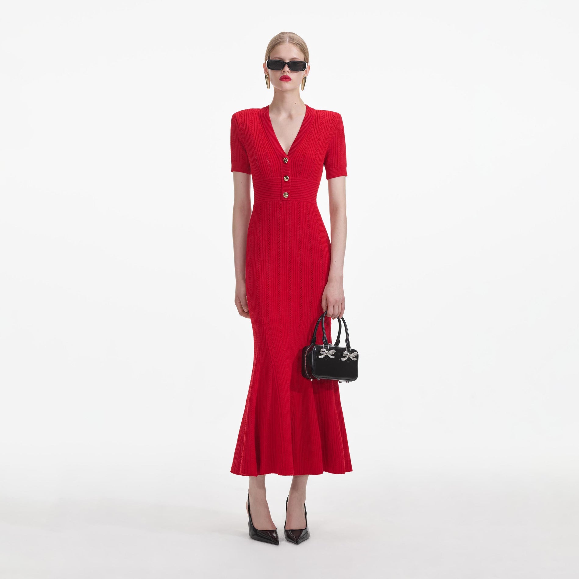 Front view of a woman wearing the Red Pointelle Knit Midi Dress
