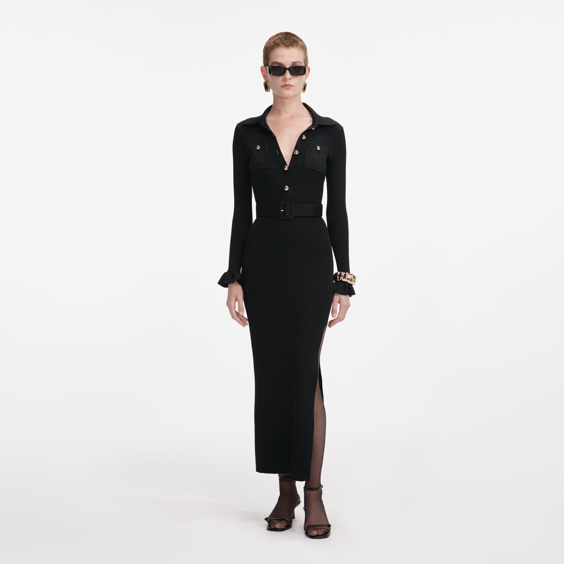 Front view of a woman wearing the Black Ribbed Knit Maxi Dress