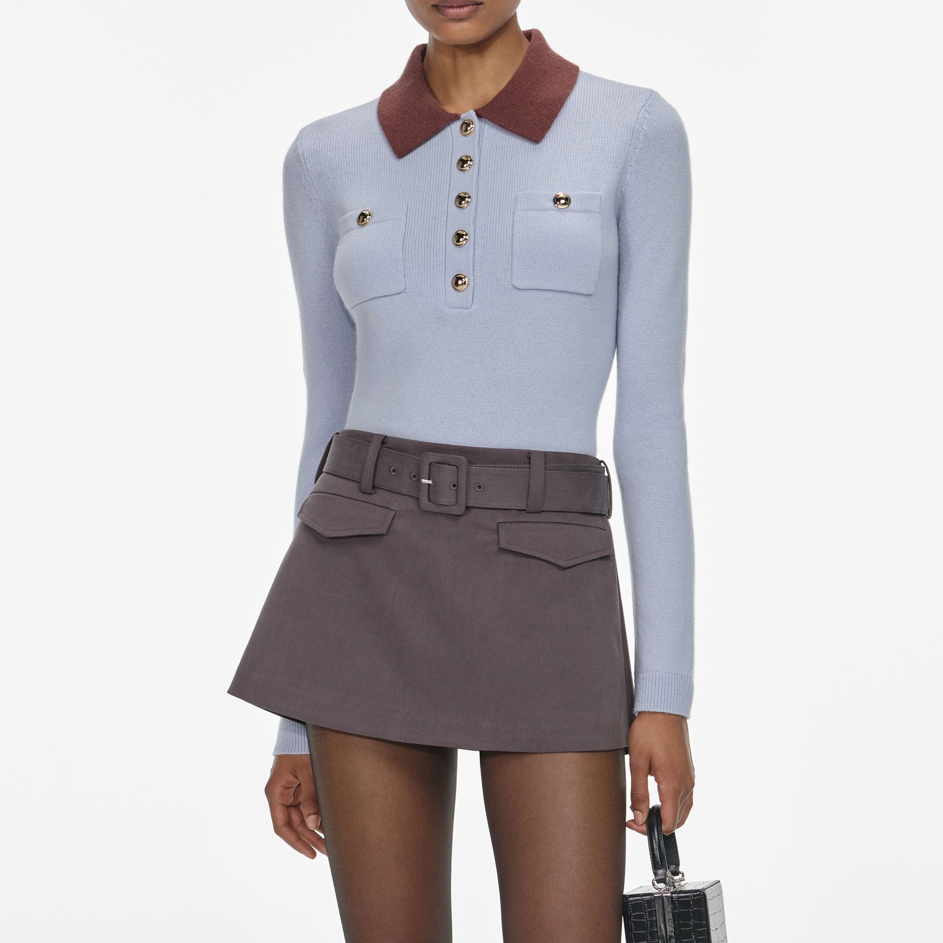 A close up of a woman wearing the Burgundy Contrast Collar Knit Top