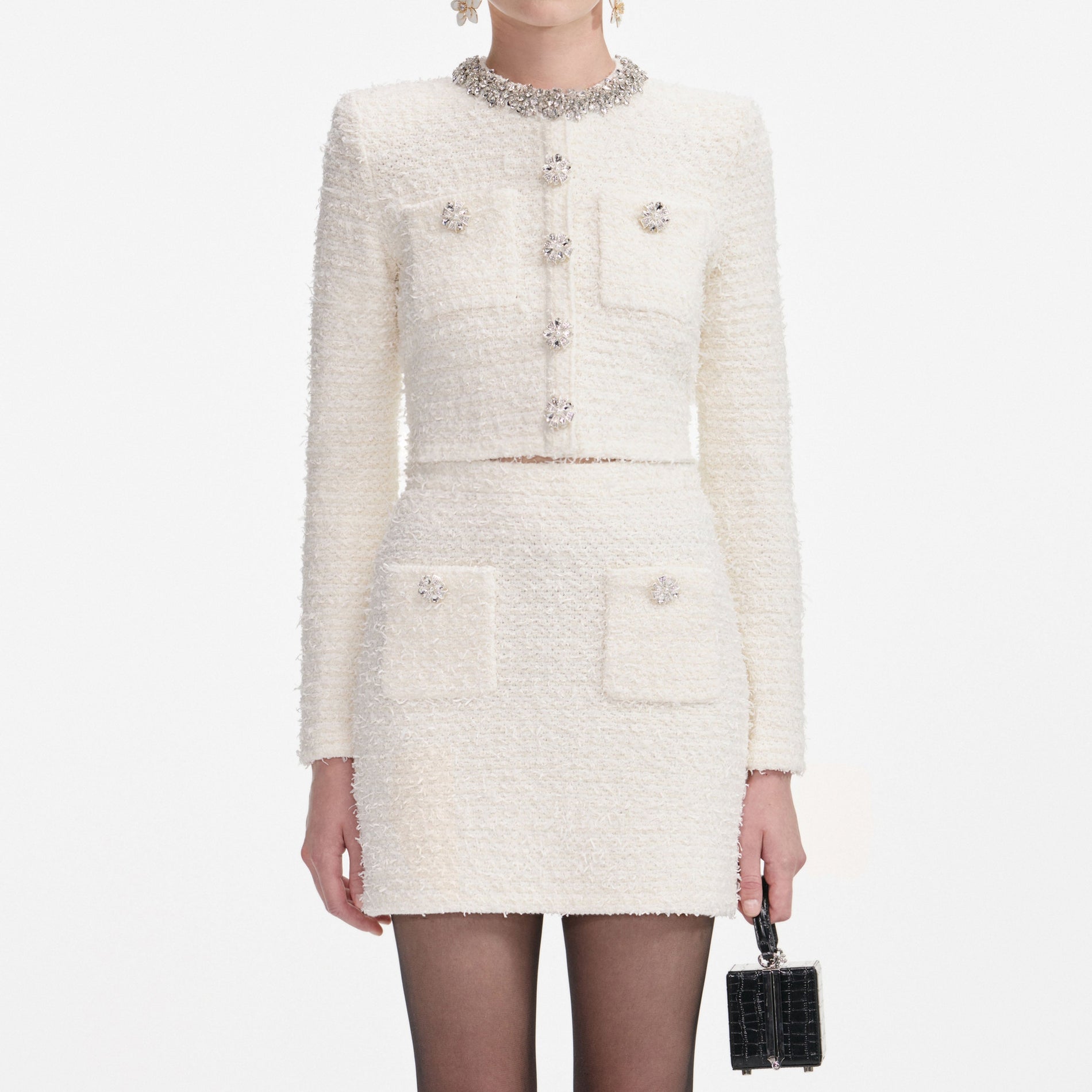 A close up of a woman wearing the Cream Textured Knit Cardigan