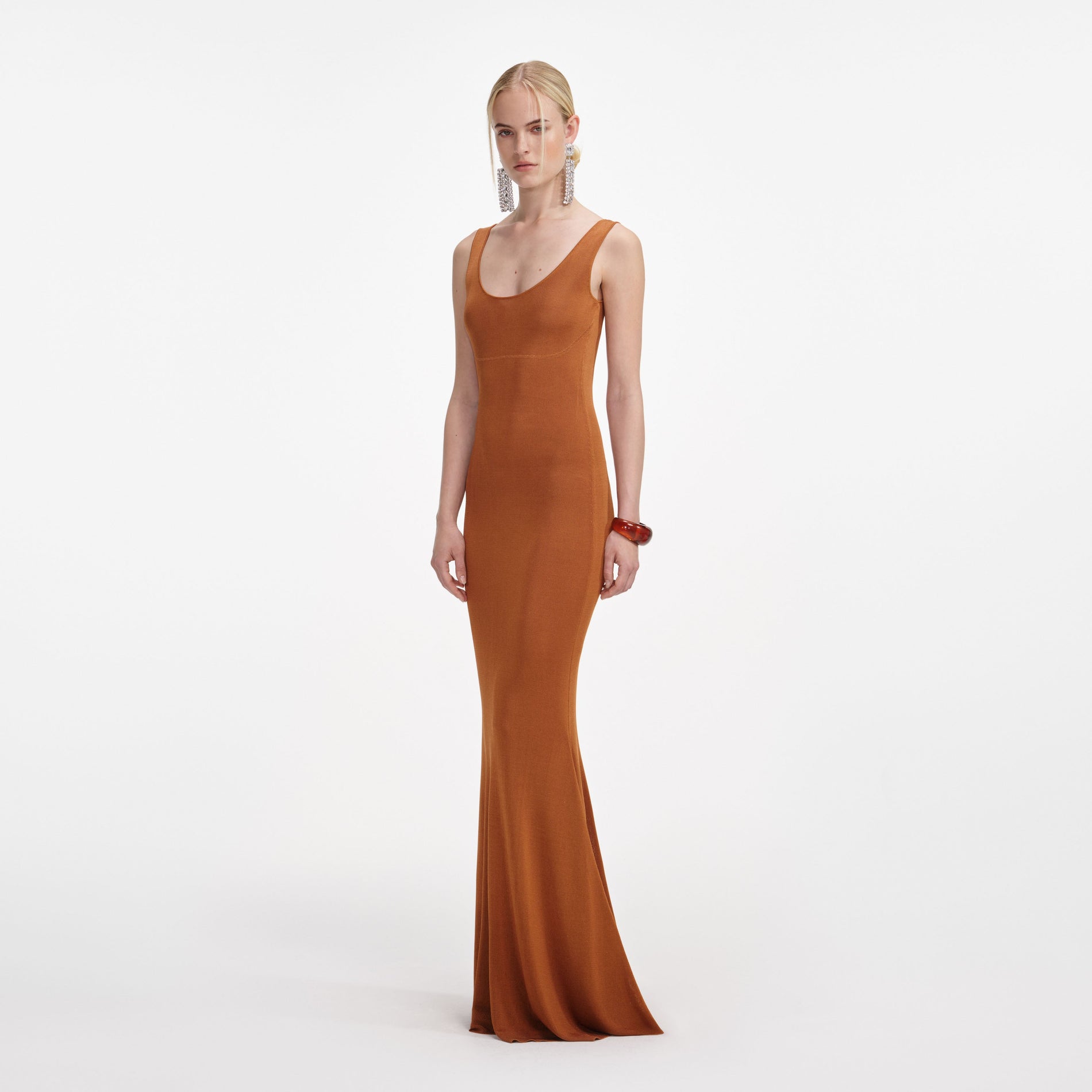 Side view of a woman wearing the Brown Racer Back Viscose Knit Maxi Dress