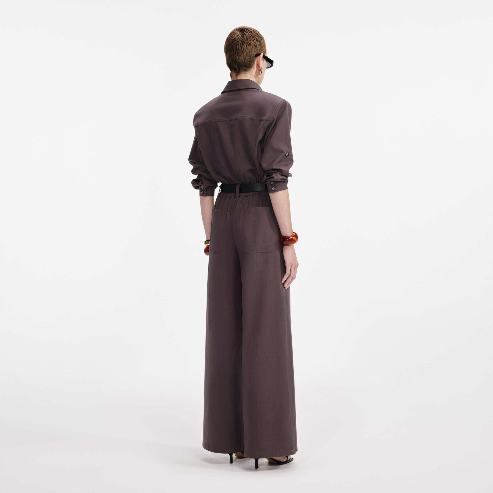 Back view of a woman wearing the Brown Twill Jumpsuit