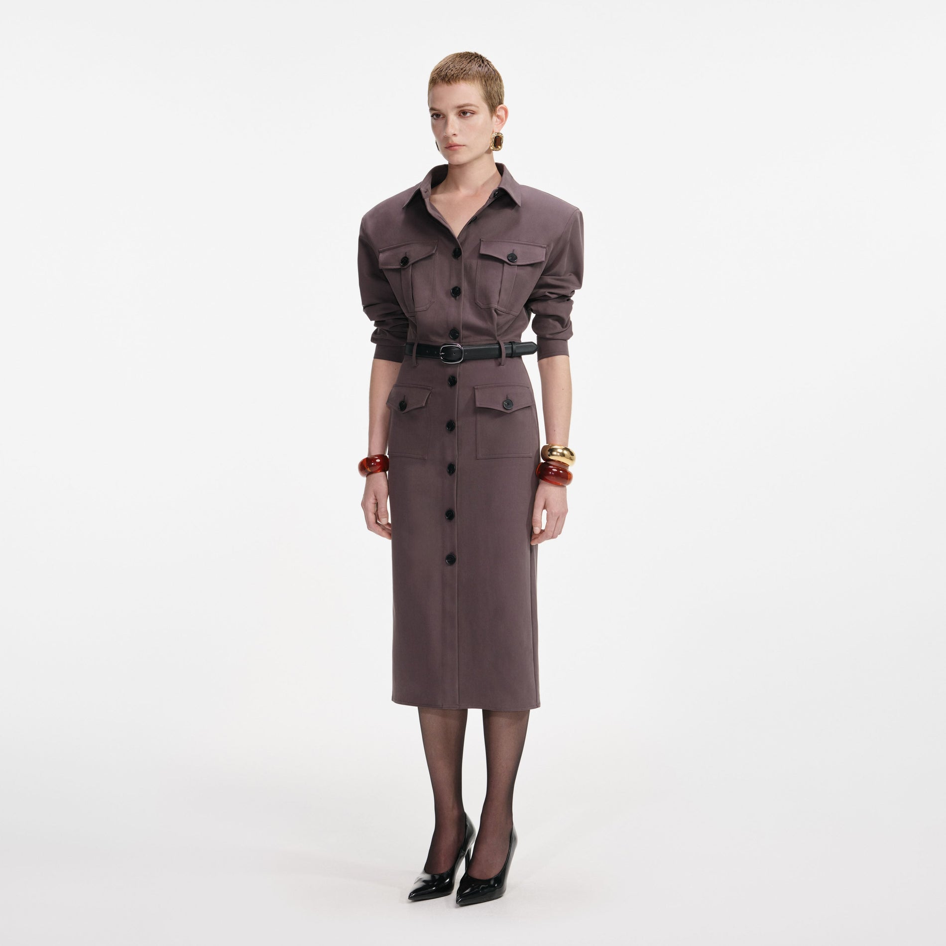 Side view of a woman wearing the Brown Cotton Belted Midi Dress