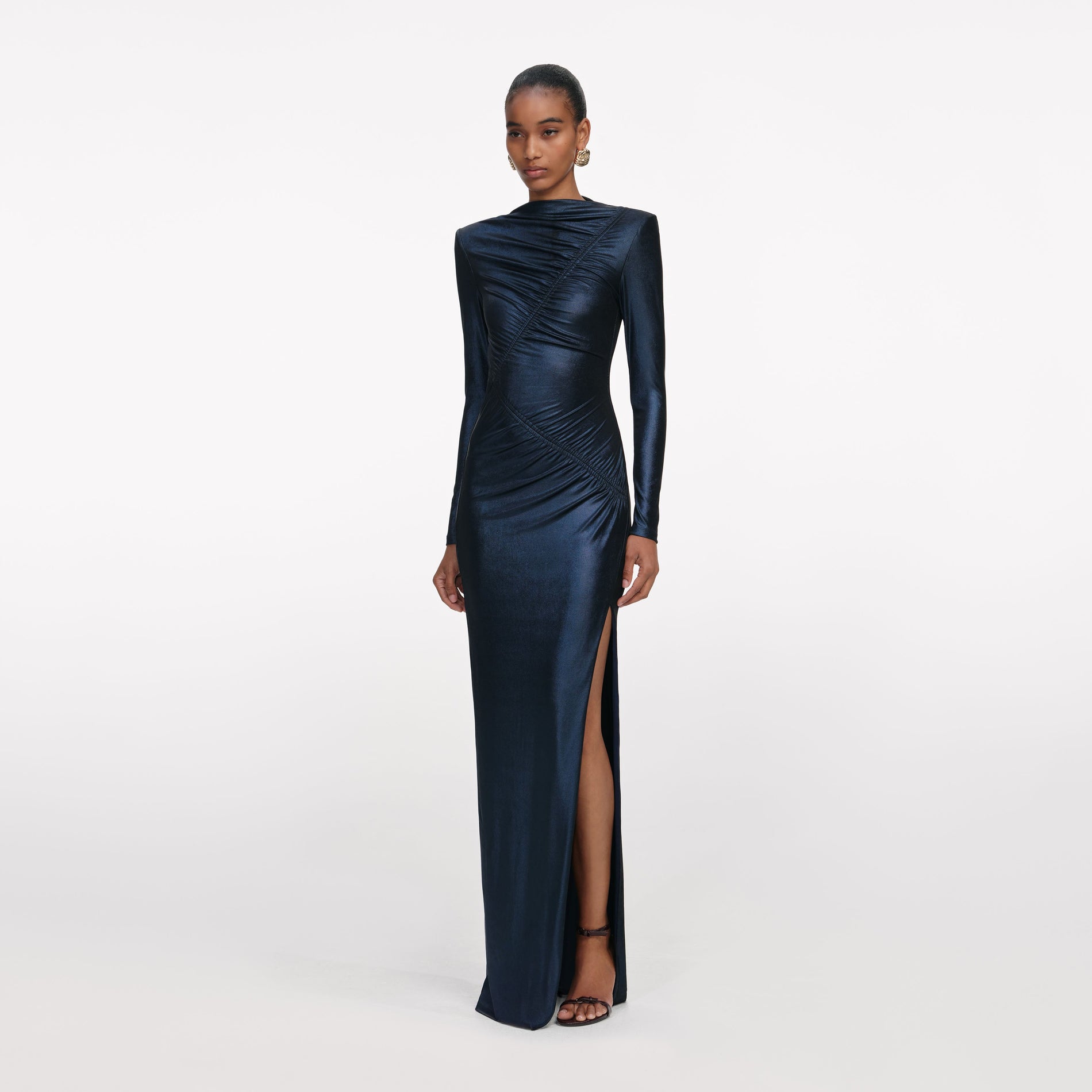 Side view of a woman wearing the Navy Metallic Gathered Maxi Dress