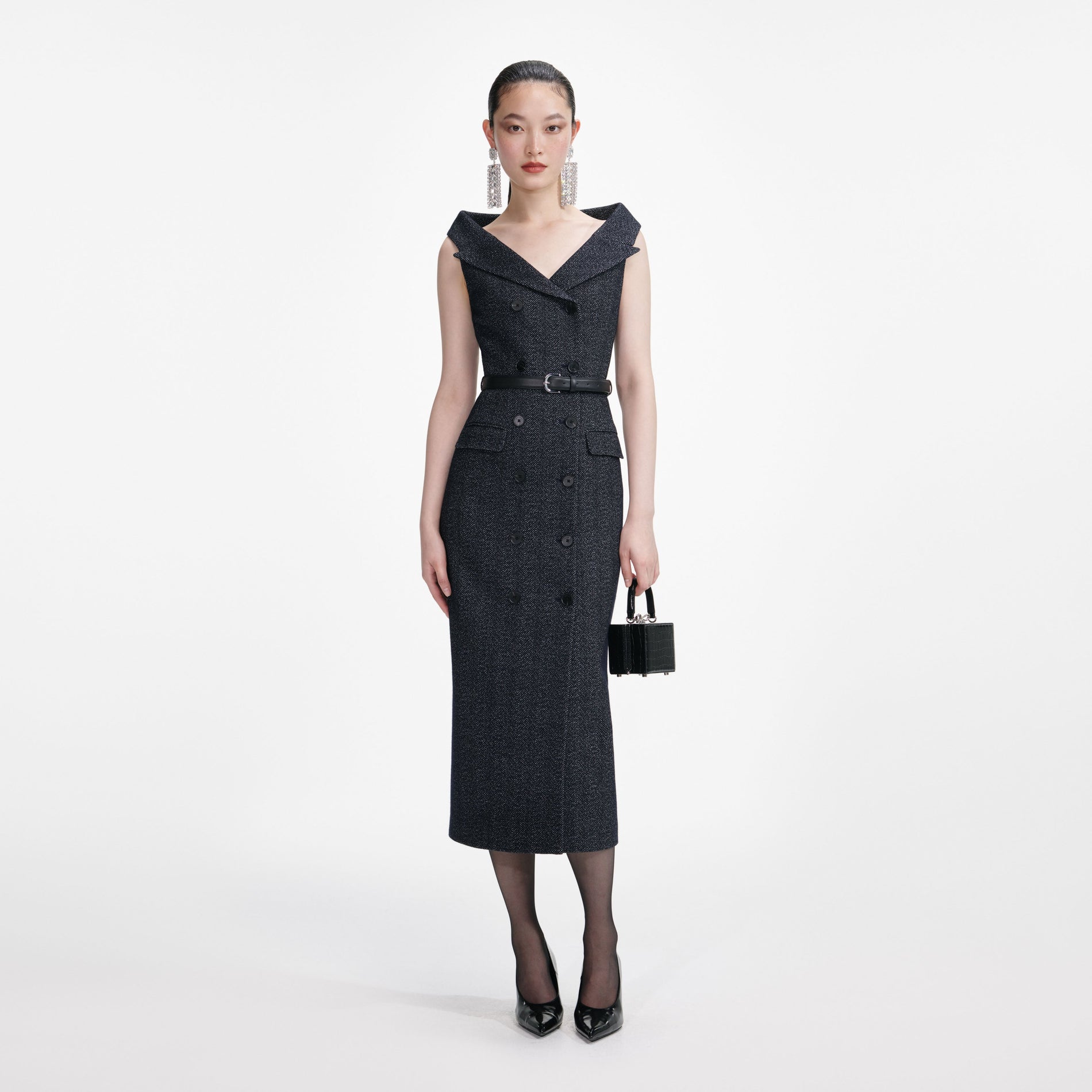Front view of a woman wearing the Navy Herringbone Wool Midi Dress
