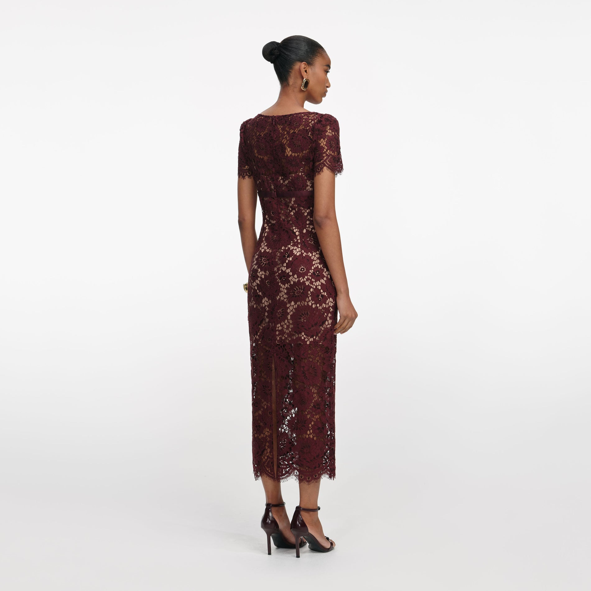 Back view of a woman wearing the Burgundy Floral Lace Midi Dress