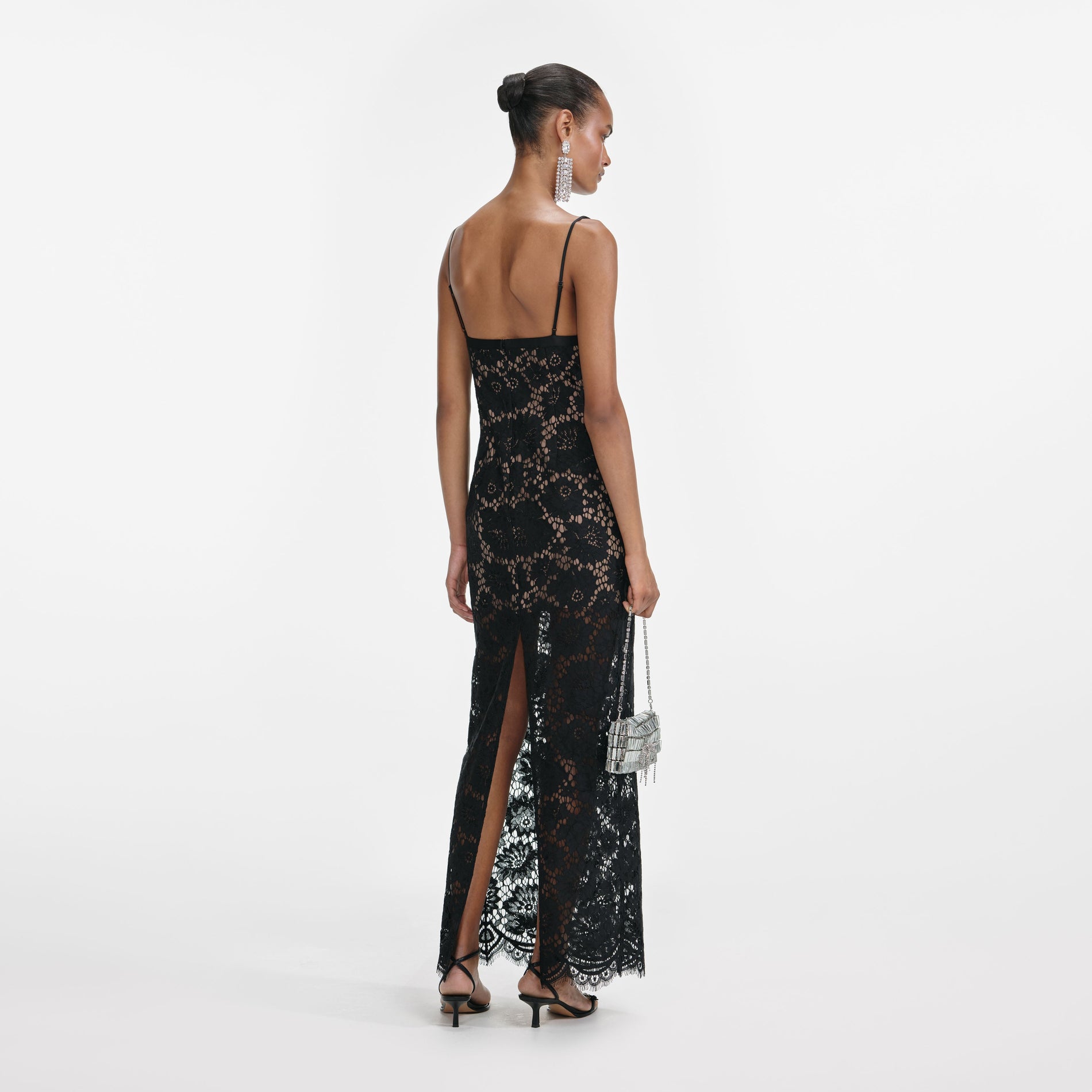 Back view of a woman wearing the Black Floral Lace Maxi Dress