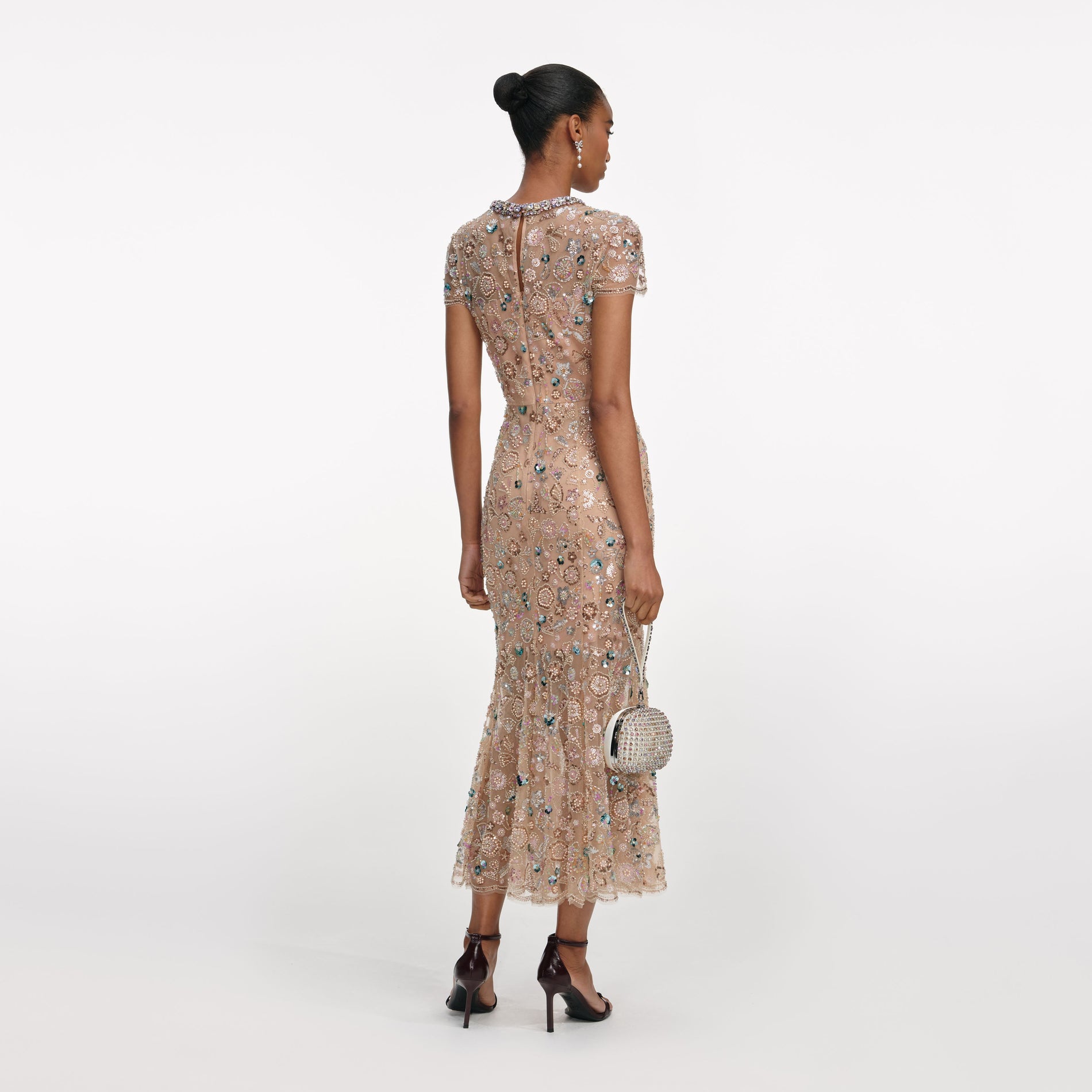 Back view of a woman wearing the Champagne Sequin Embroidered Midi Dress