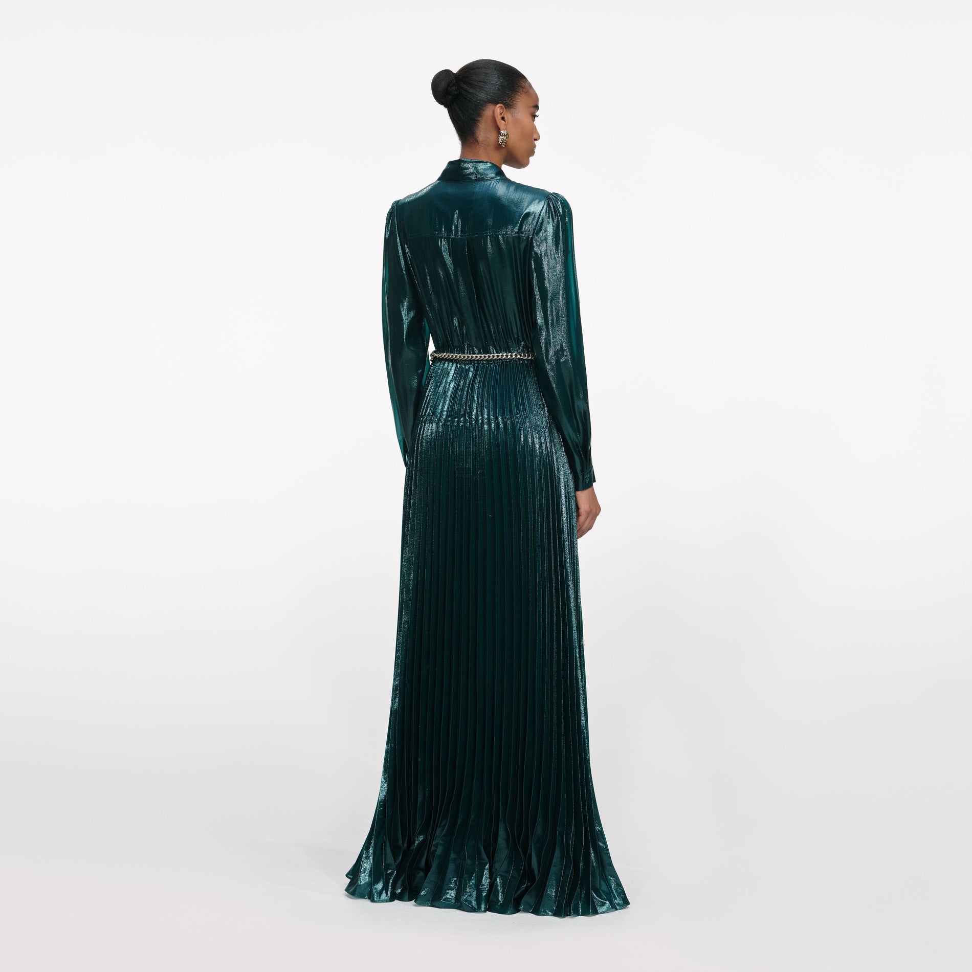 Back view of a woman wearing the Green Metallic Pussy Bow Maxi Dress