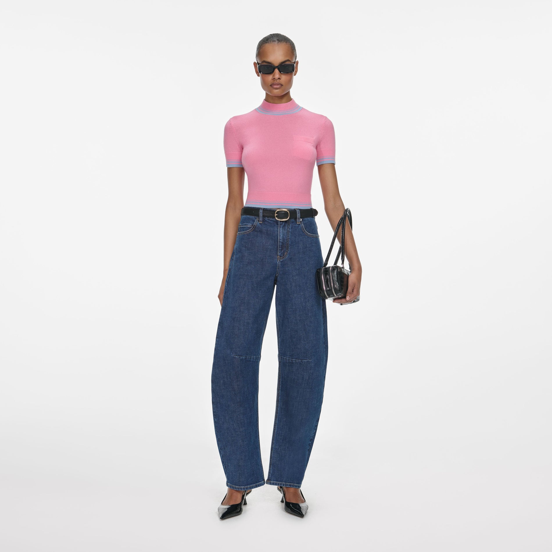 Front view of a woman wearing the Blue Barrel Leg Jeans