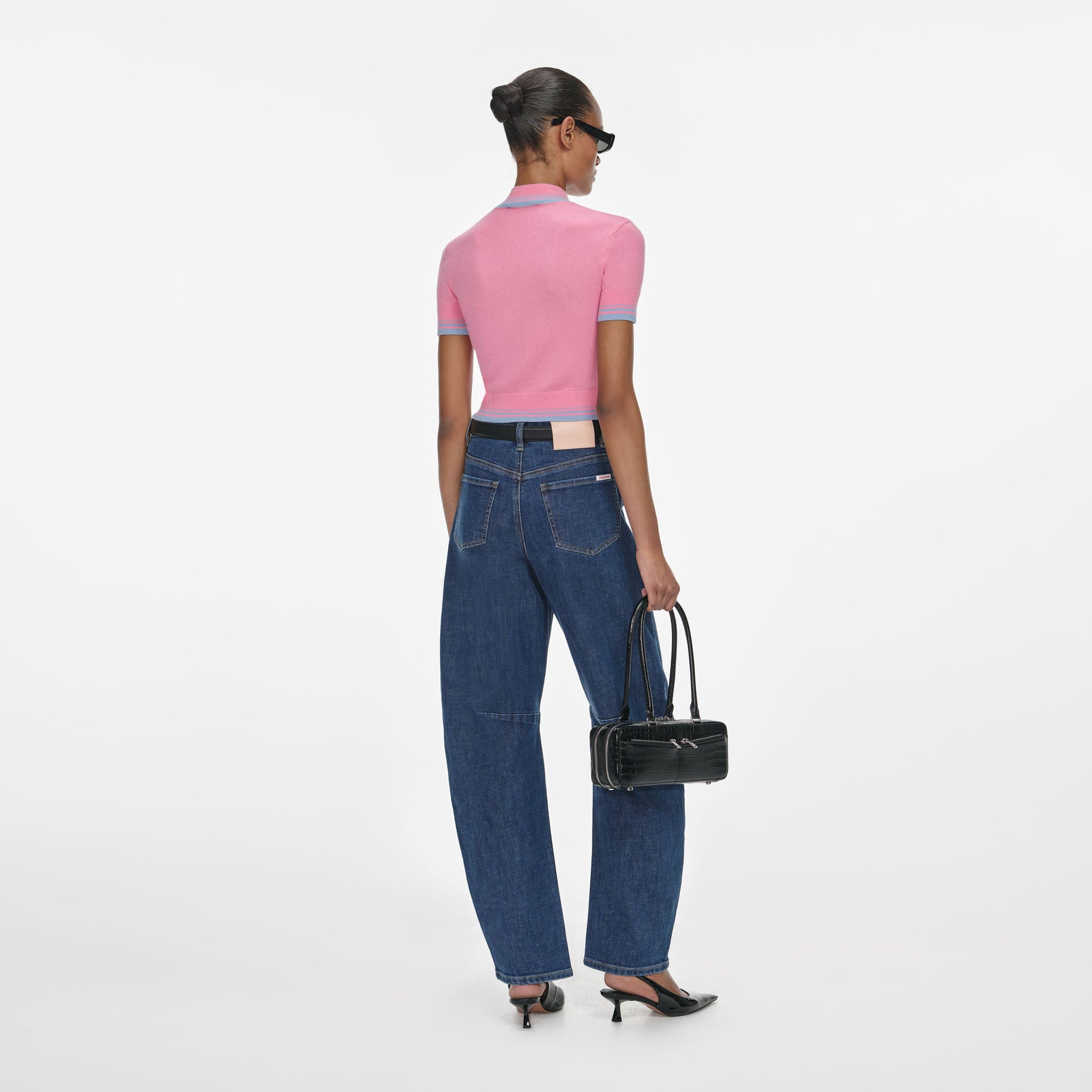 Back view of a woman wearing the Blue Barrel Leg Jeans