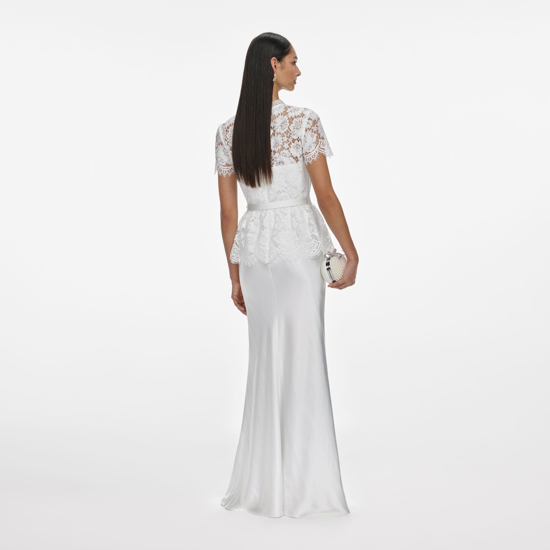 Back view of a woman wearing the White Lace Satin Maxi Dress