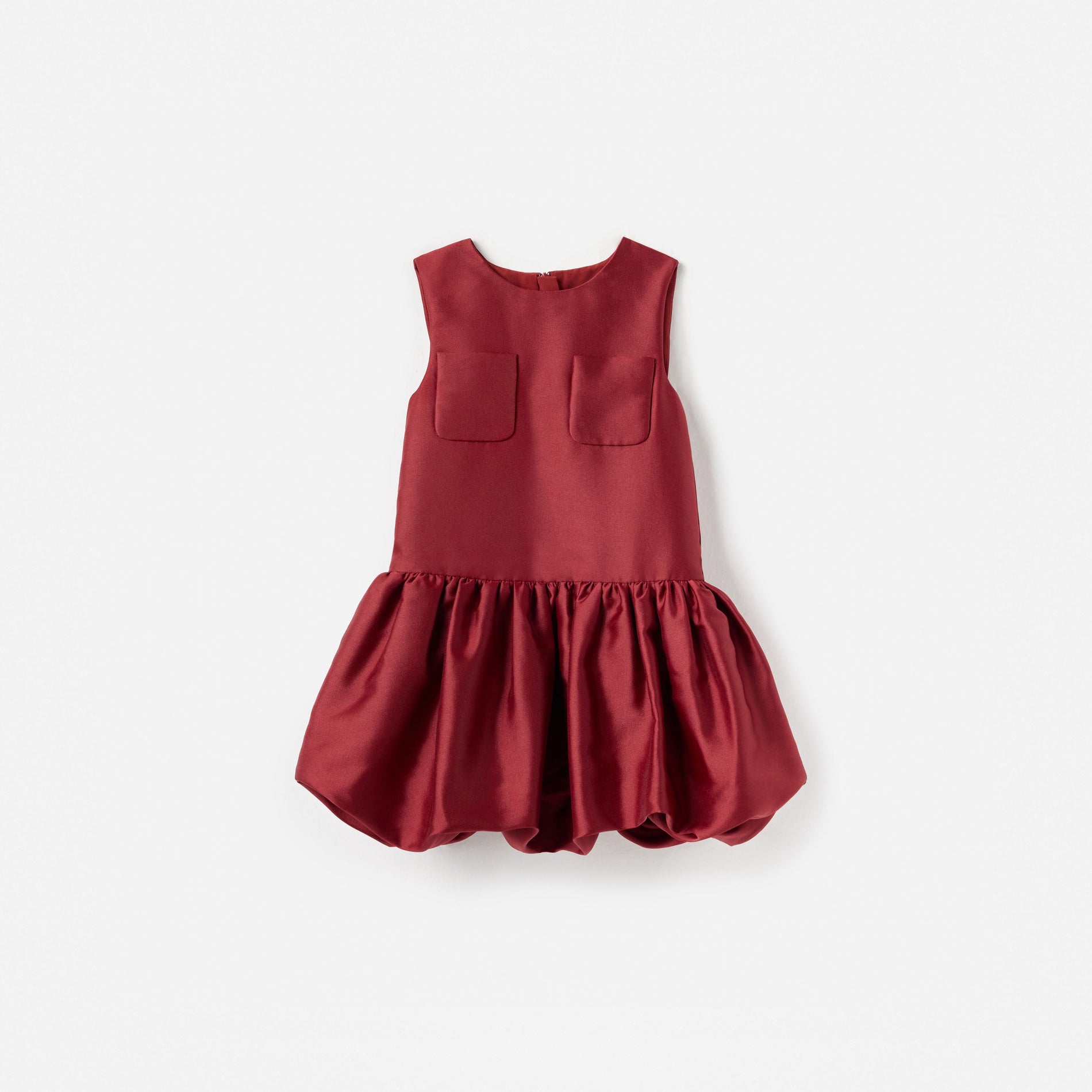 Red sleeveless dress with two front pockets and a gathered bubble skirt