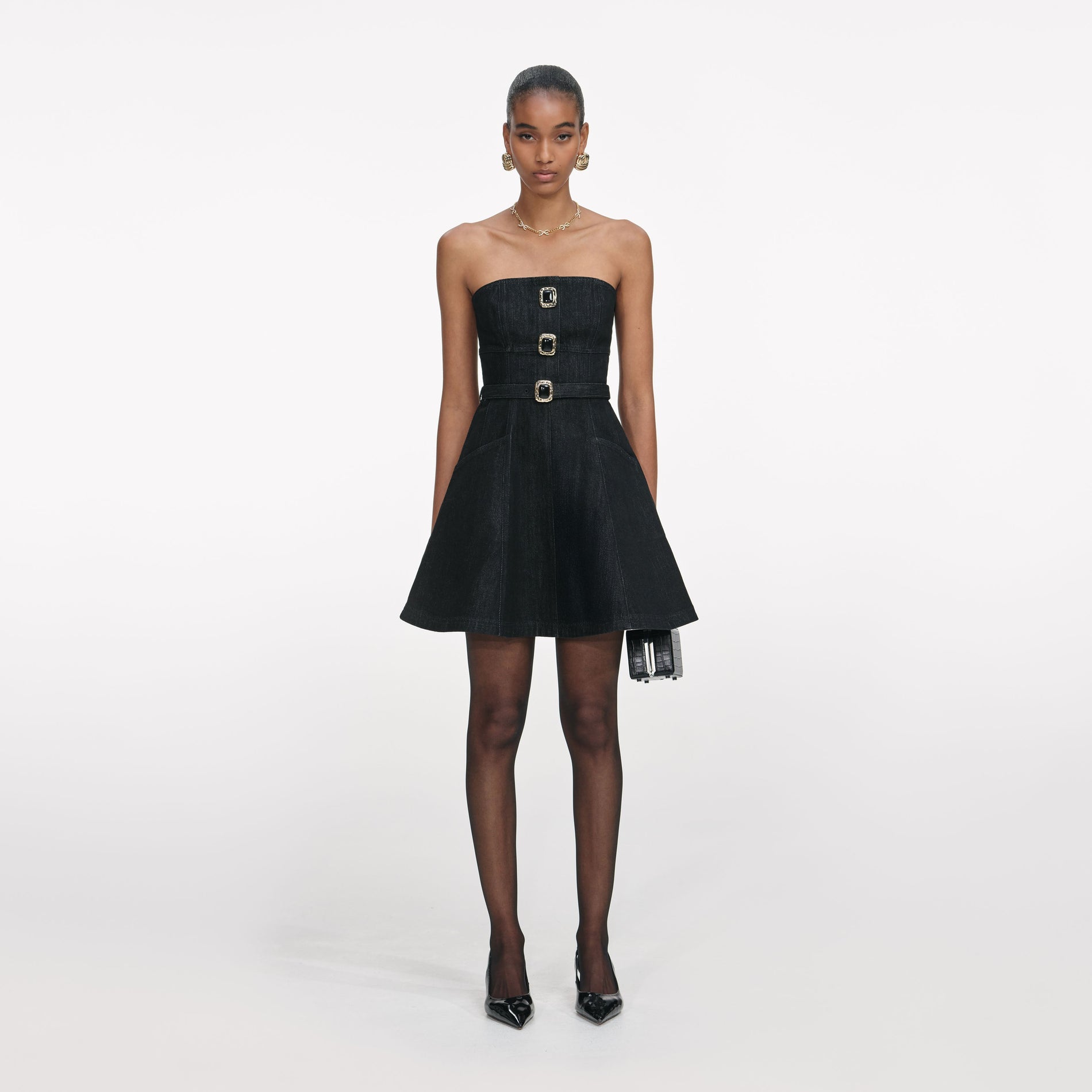 Front view of a woman wearing the Black Denim Bandeau Mini Dress