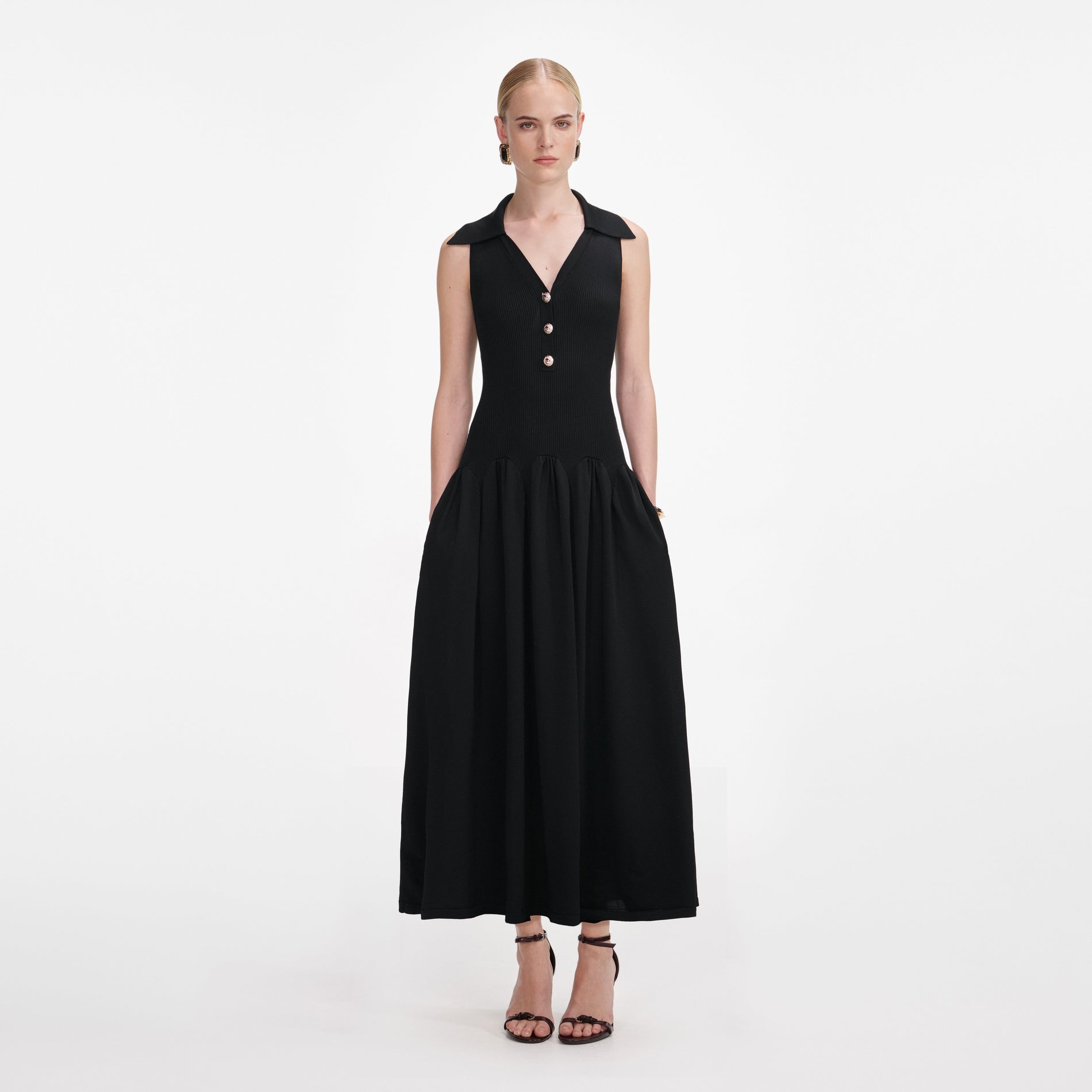 Front view of a woman wearing the Black Ribbed Knit Midi Dress