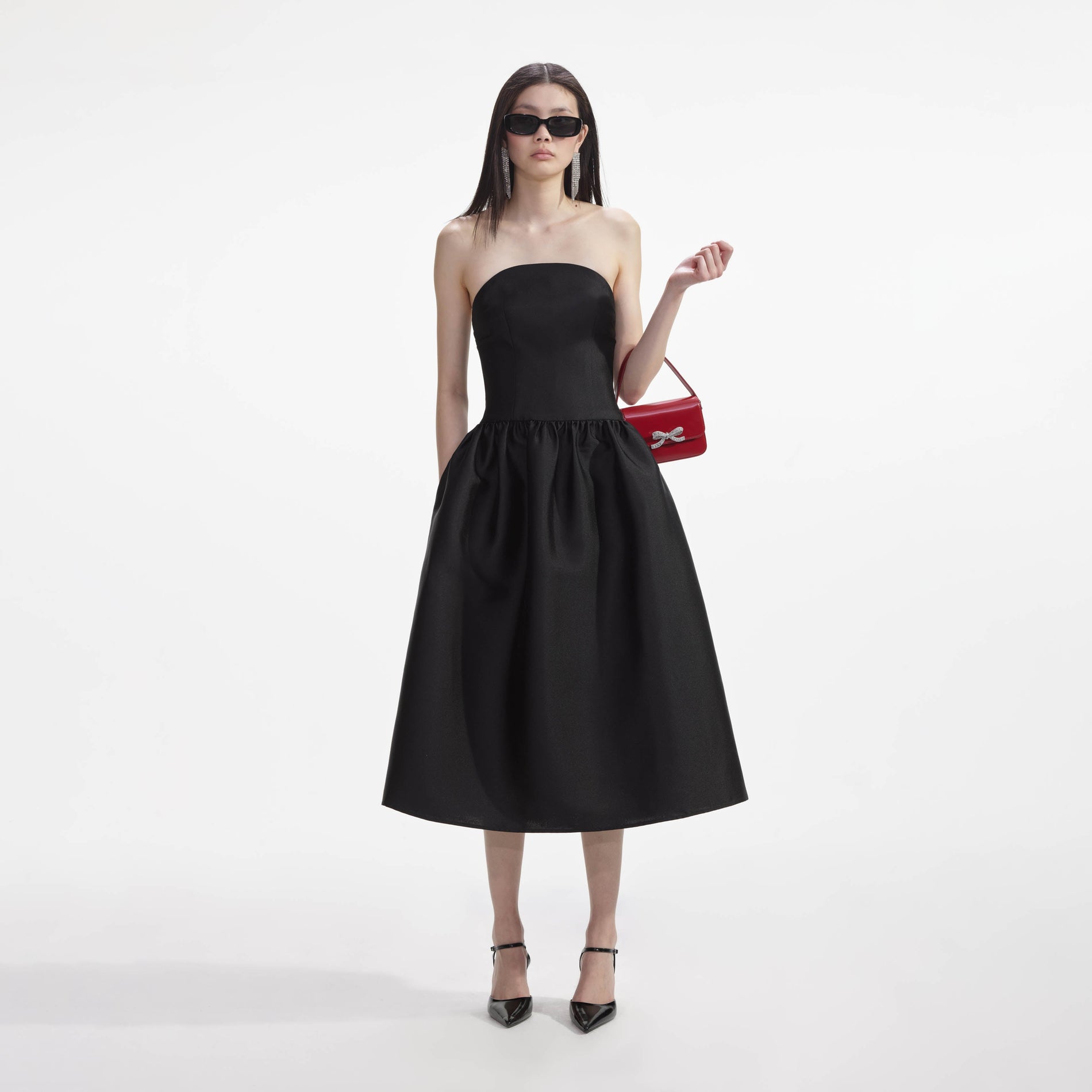 Front view of a woman wearing the Black Taffeta Midi Dress