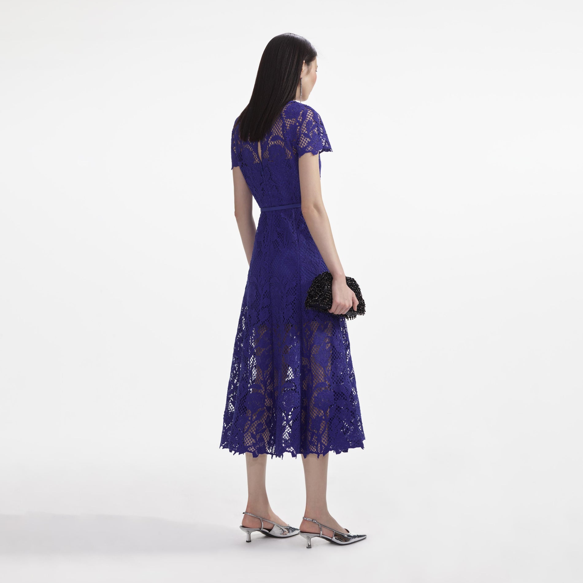Back view of a woman wearing the Cobalt Lace Midi Dress