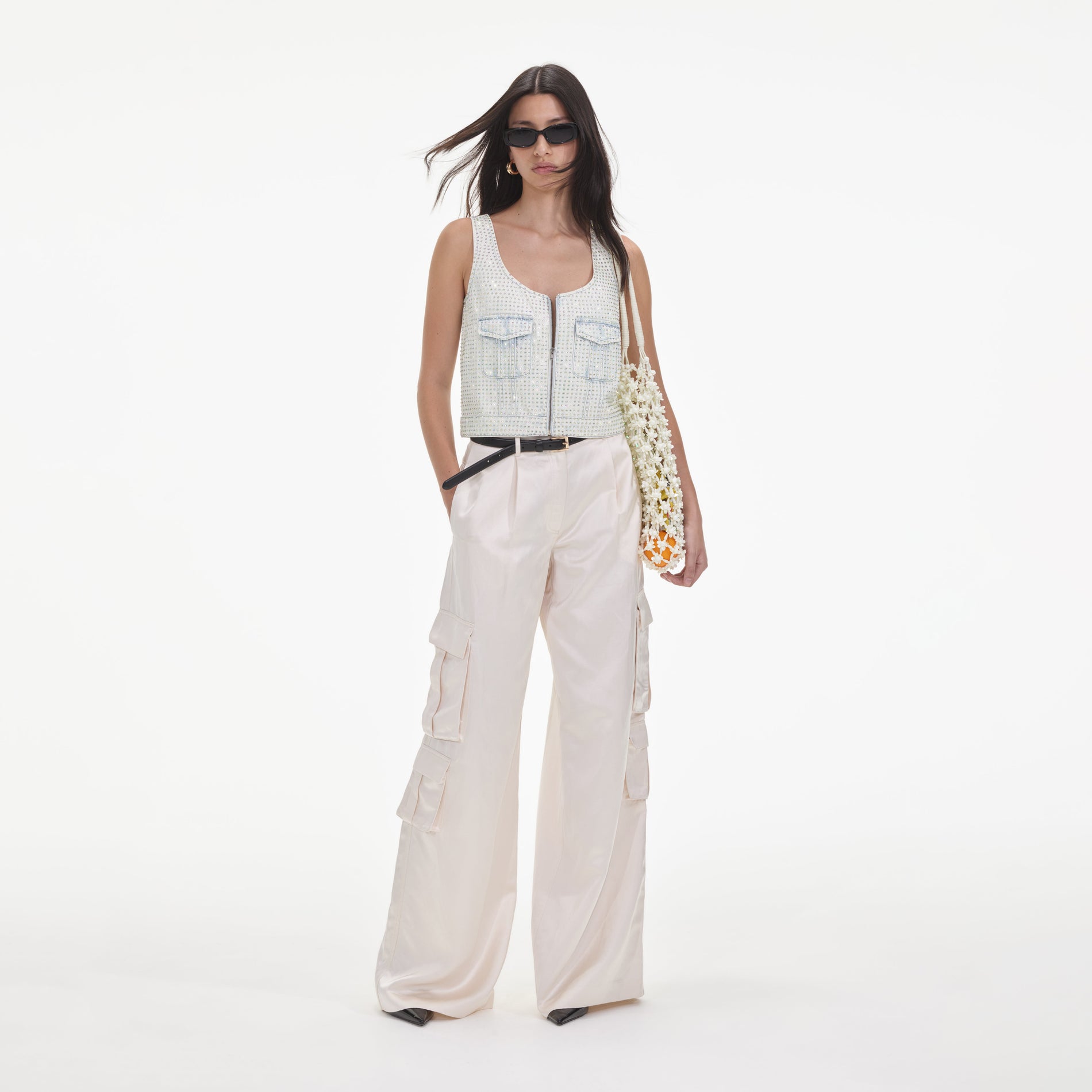 Front view of a woman wearing the Cream Satin Cargo Trousers