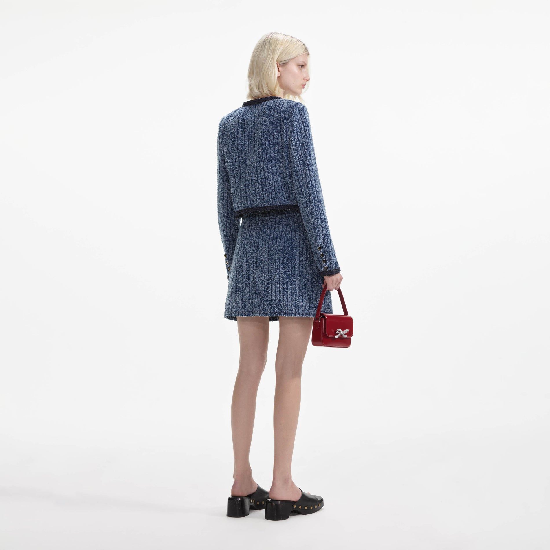 Back view of a woman wearing the Textured Denim Jacket