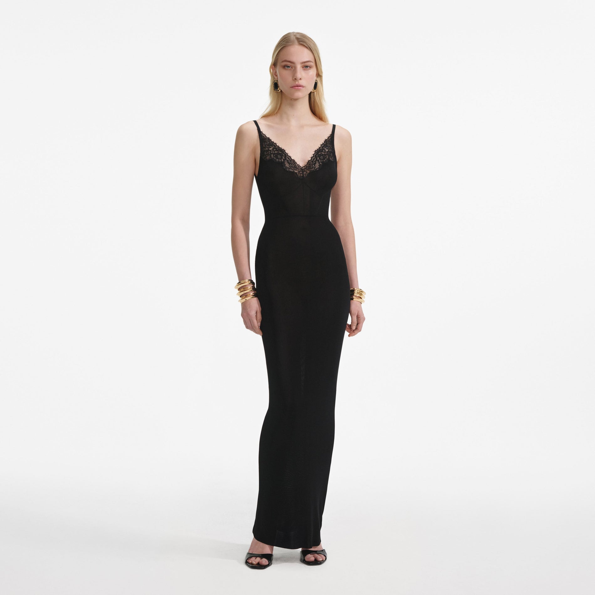 Front view of a woman wearing the Black Viscose Knit Maxi Dress