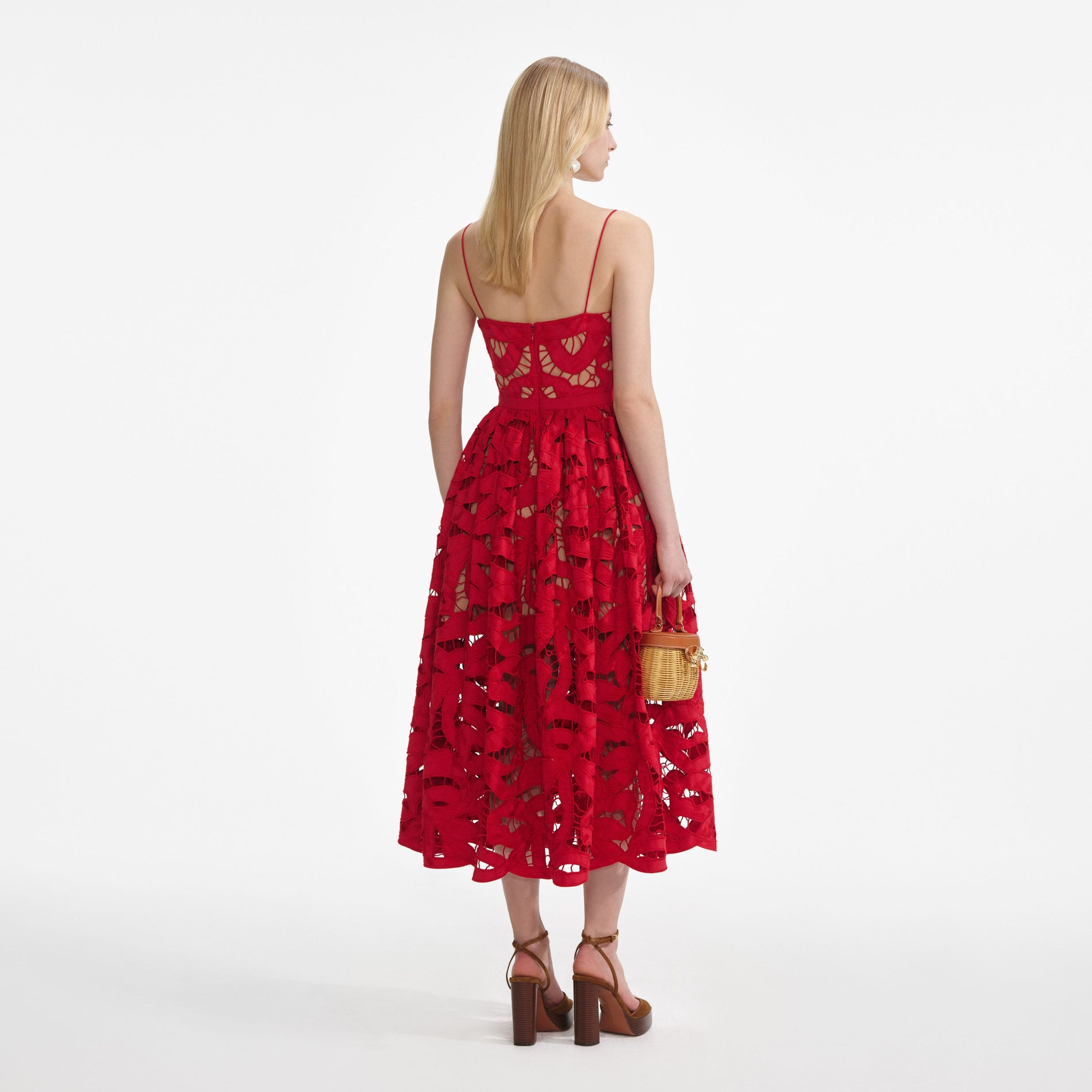 Back view of a woman wearing the Red Bow Embroidered Midi Dress