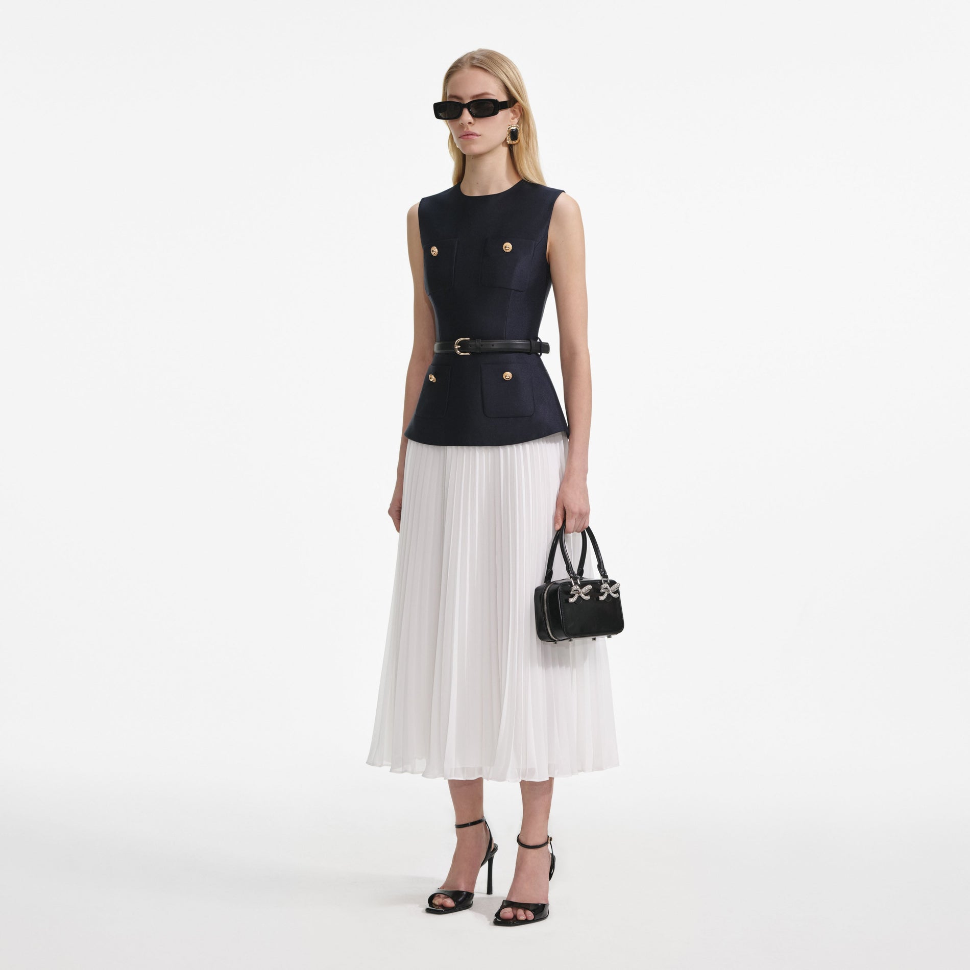 Side view of a woman wearing the Navy Taffeta Midi Dress