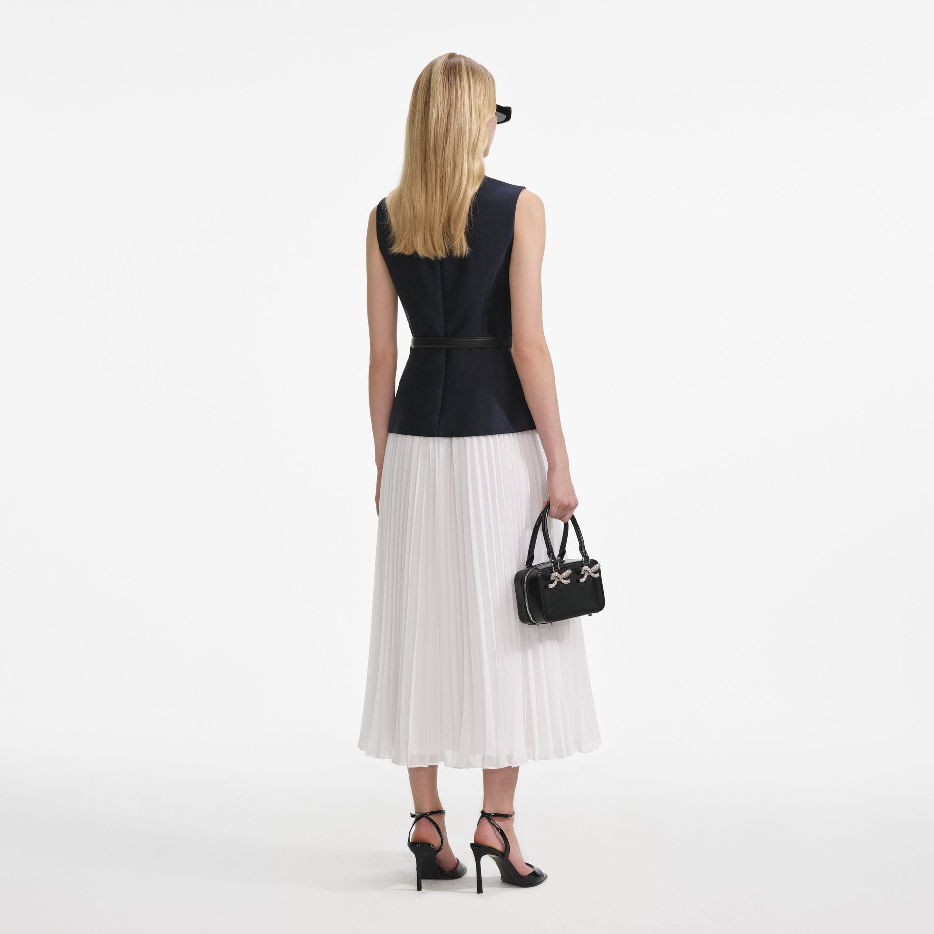 Back view of a woman wearing the Navy Taffeta Midi Dress