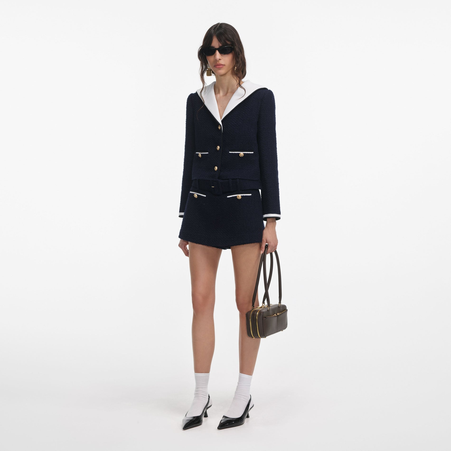 Side view of a woman wearing the Navy Boucle Contrast Collar Jacket