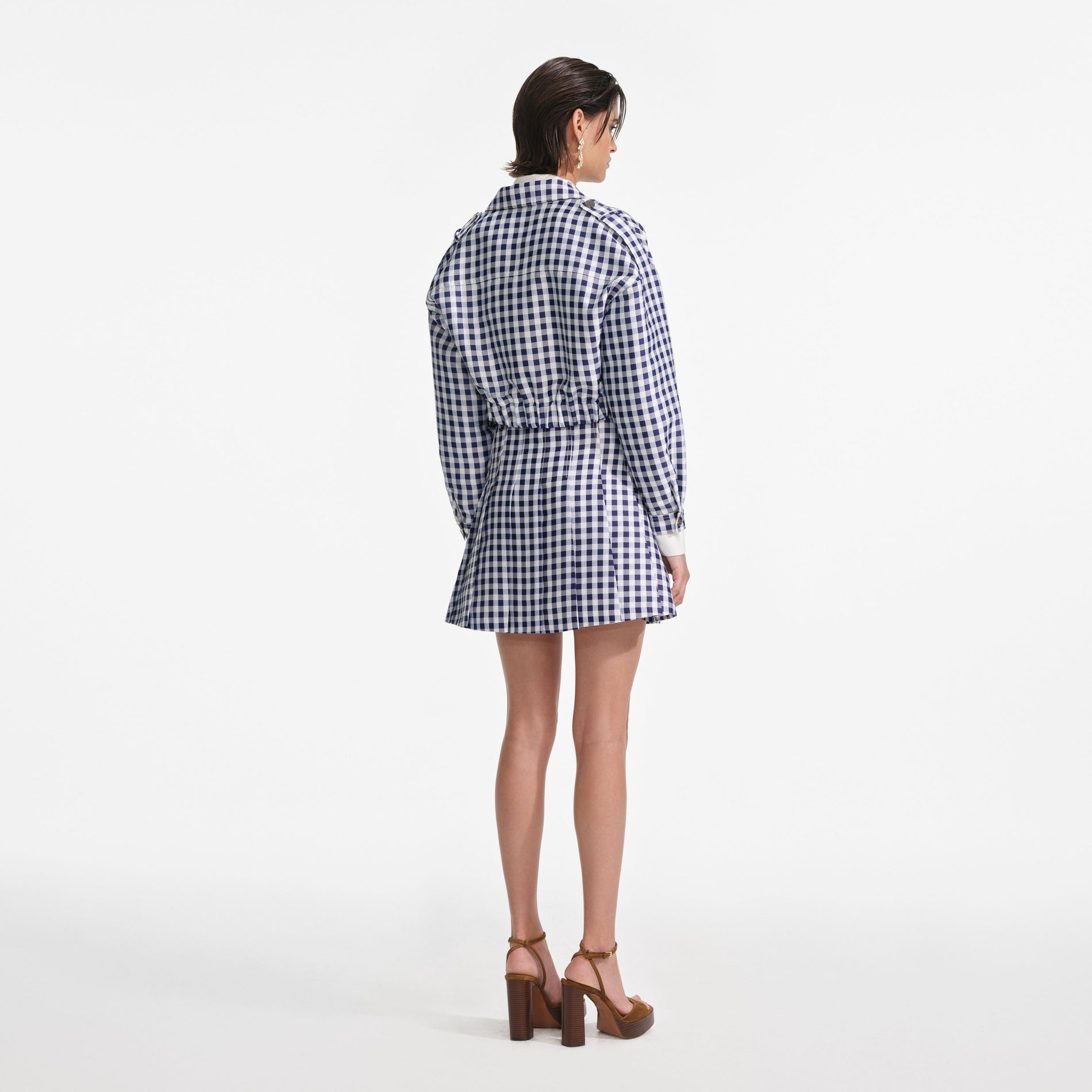 Back view of a woman wearing the Navy Gingham Taffeta Jacket
