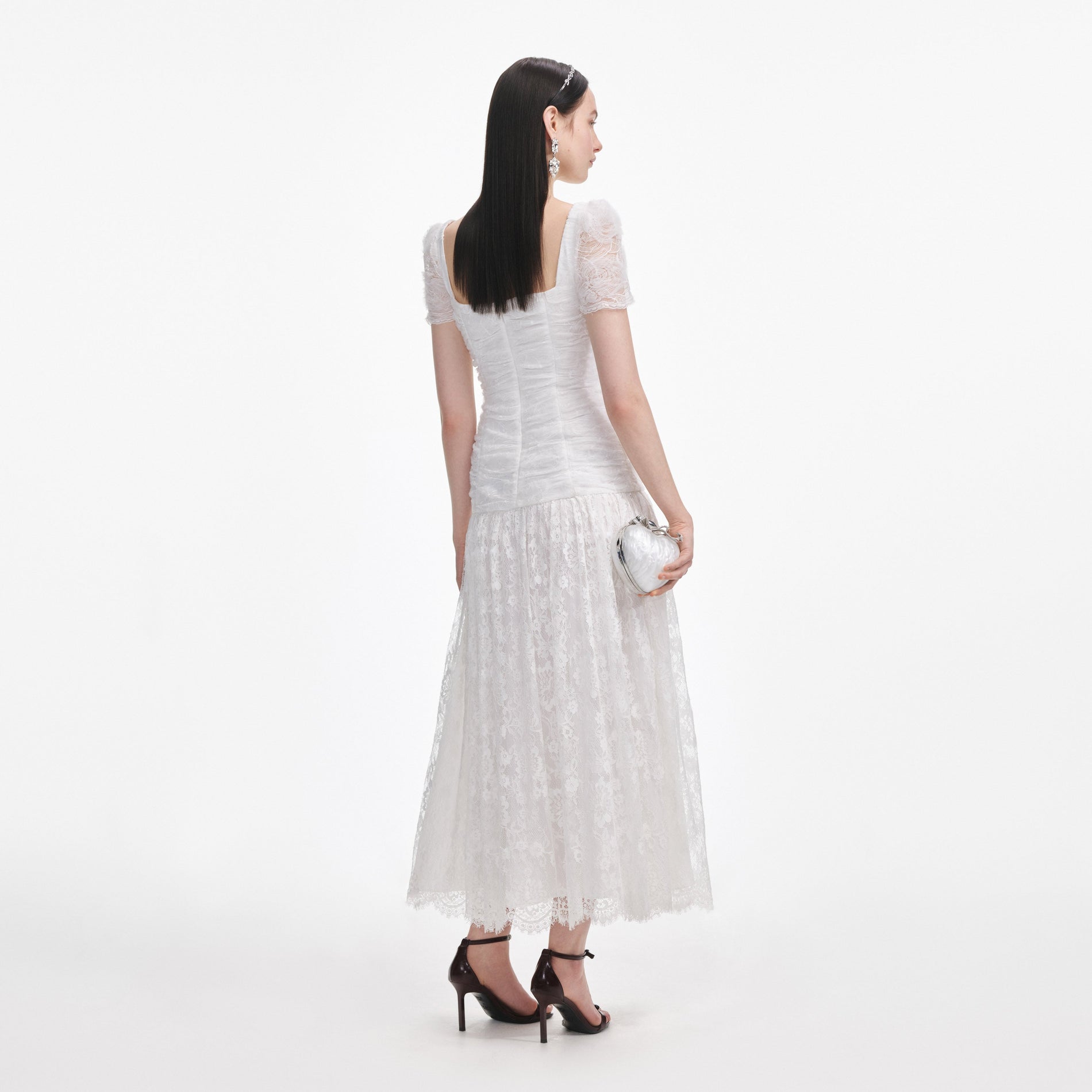 Back view of a woman wearing the White Tulle Lace Gathered Midi Dress