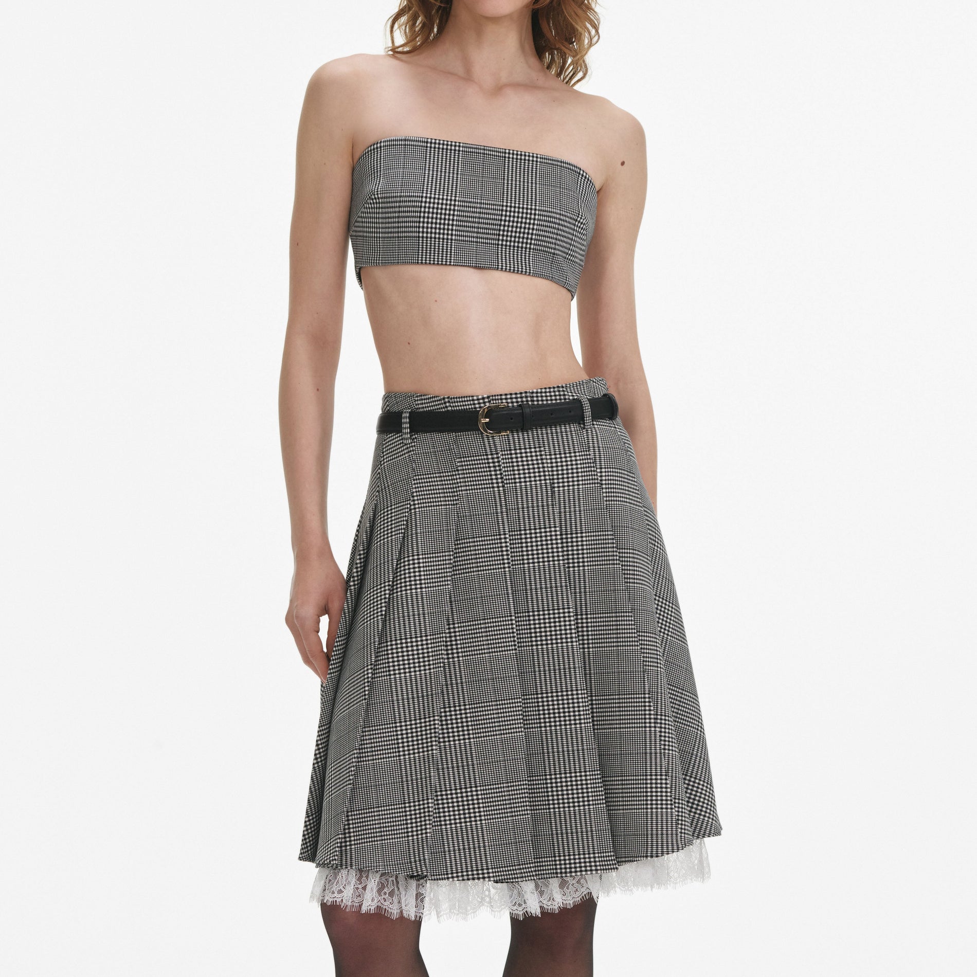 A close up of a woman wearing the Prince Of Wales Check Bandeau Top