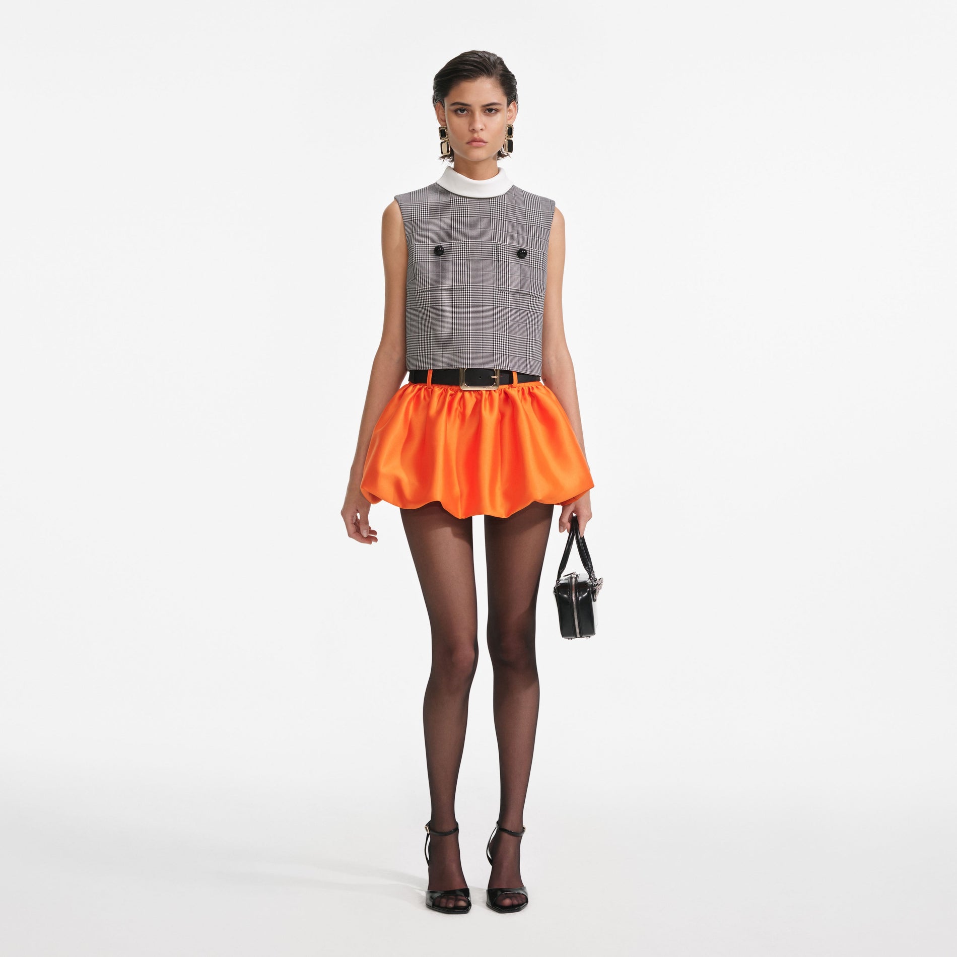 Front view of a woman wearing the Orange Taffeta Skort
