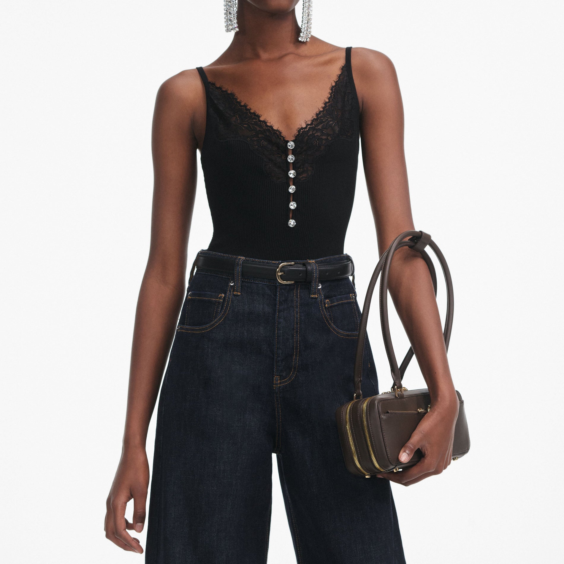 A close up of a woman wearing the Black Lace Trim Rib Knit Top