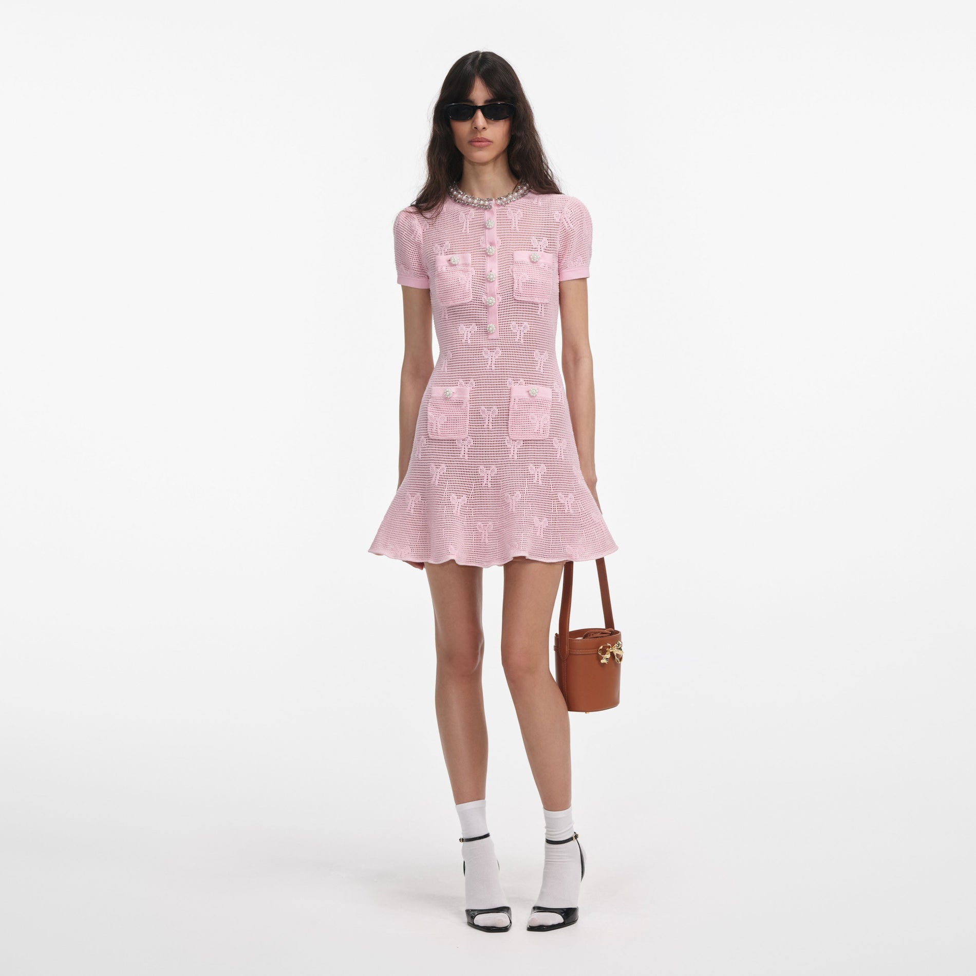Front view of a woman wearing the Pink Bow Crochet Crystal Trim Mini Dress