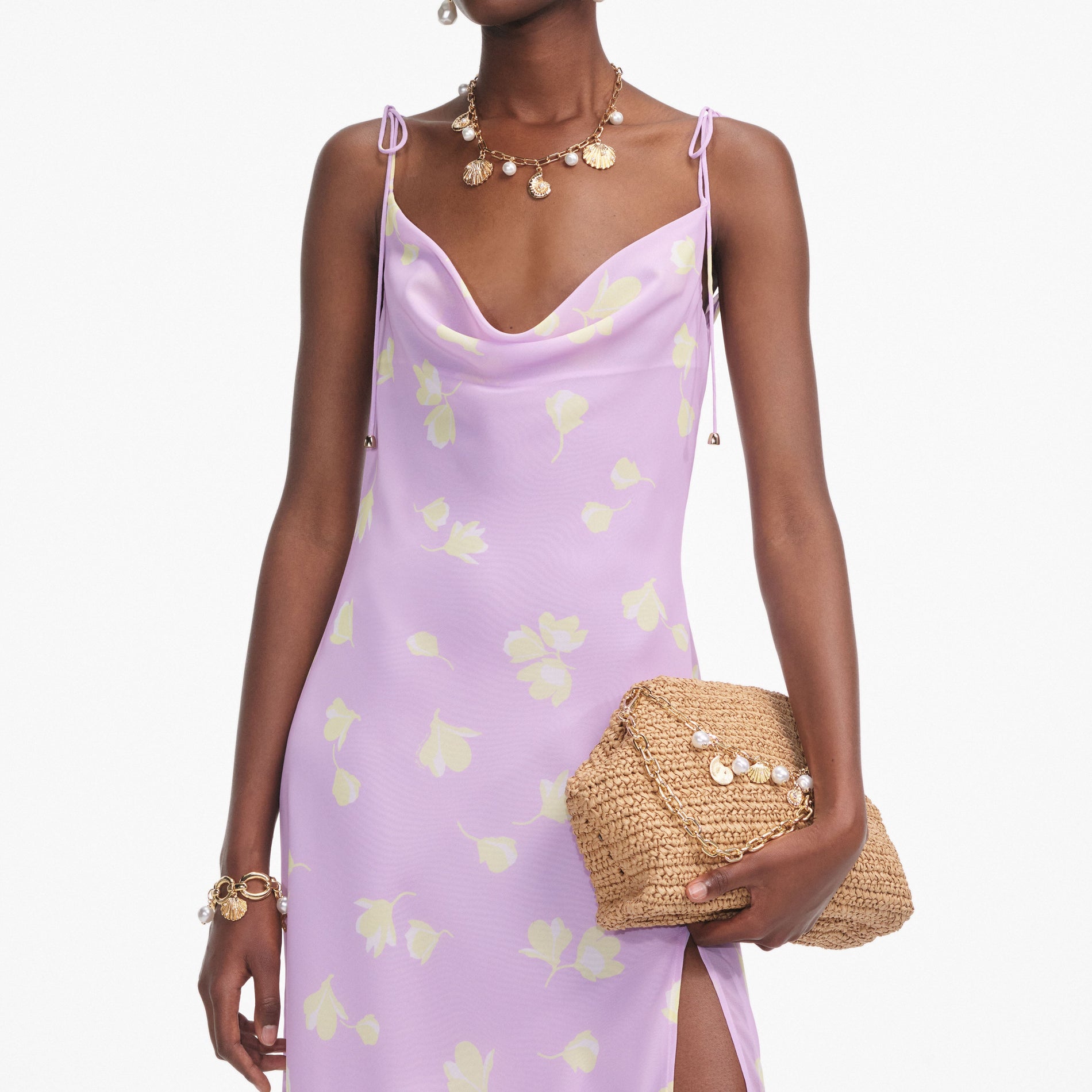 A close up of a woman wearing the Lilac Floral Chiffon Midi Dress