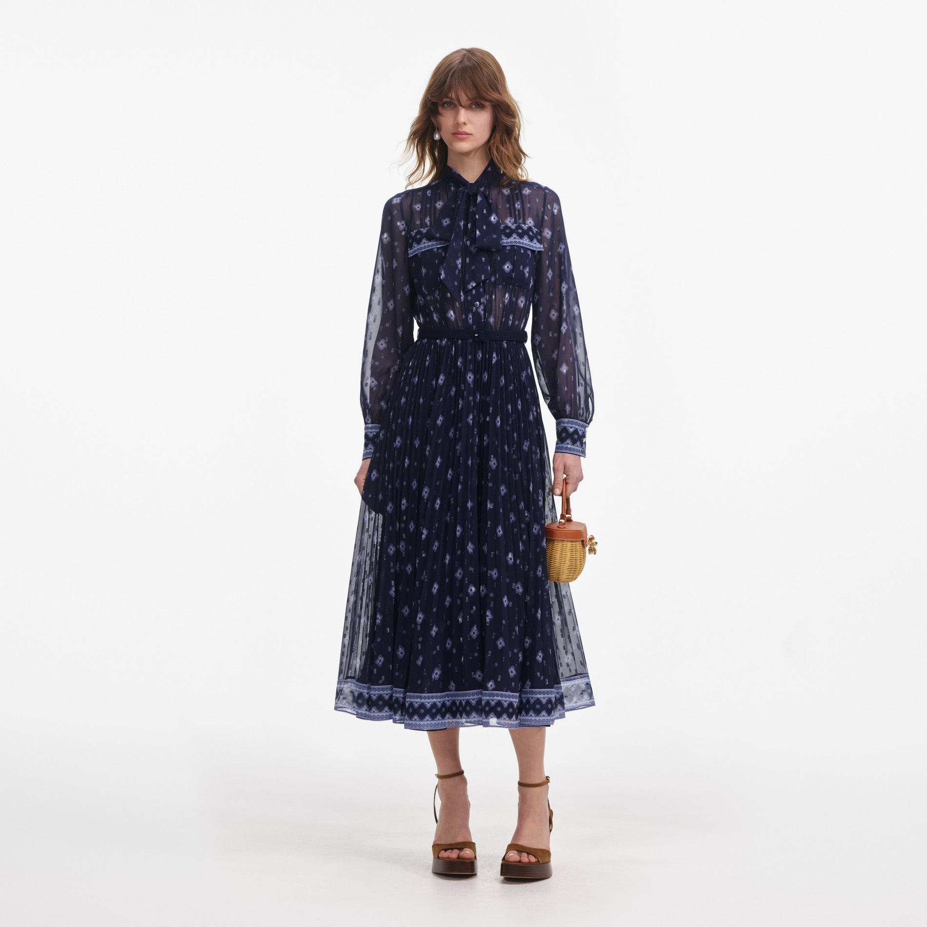 Front view of a woman wearing the Navy Printed Chiffon Midi Dress