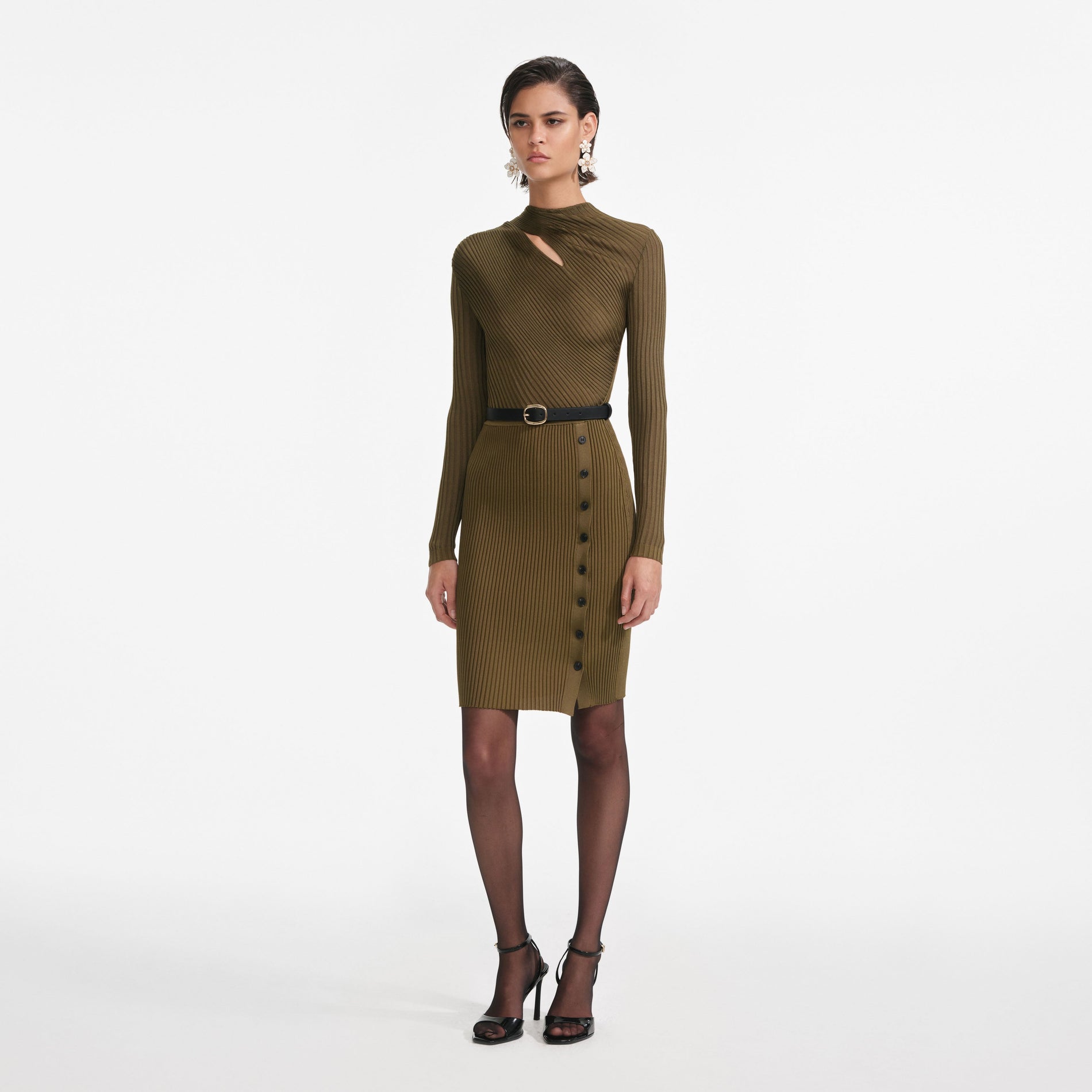 Side view of a woman wearing the Khaki Cut Out Rib Knit Mini Dress
