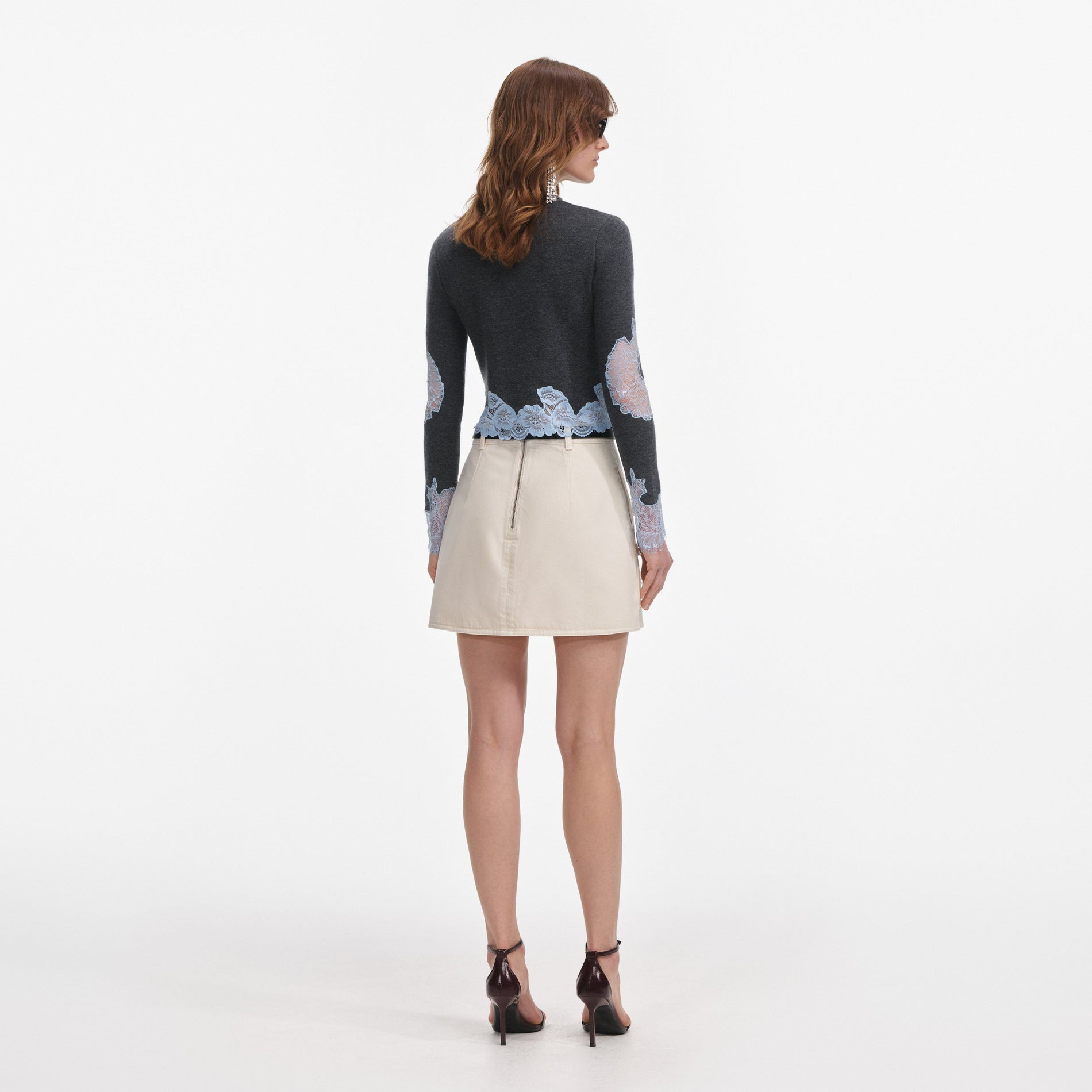 Back view of a woman wearing the Grey Contrast Lace Jumper