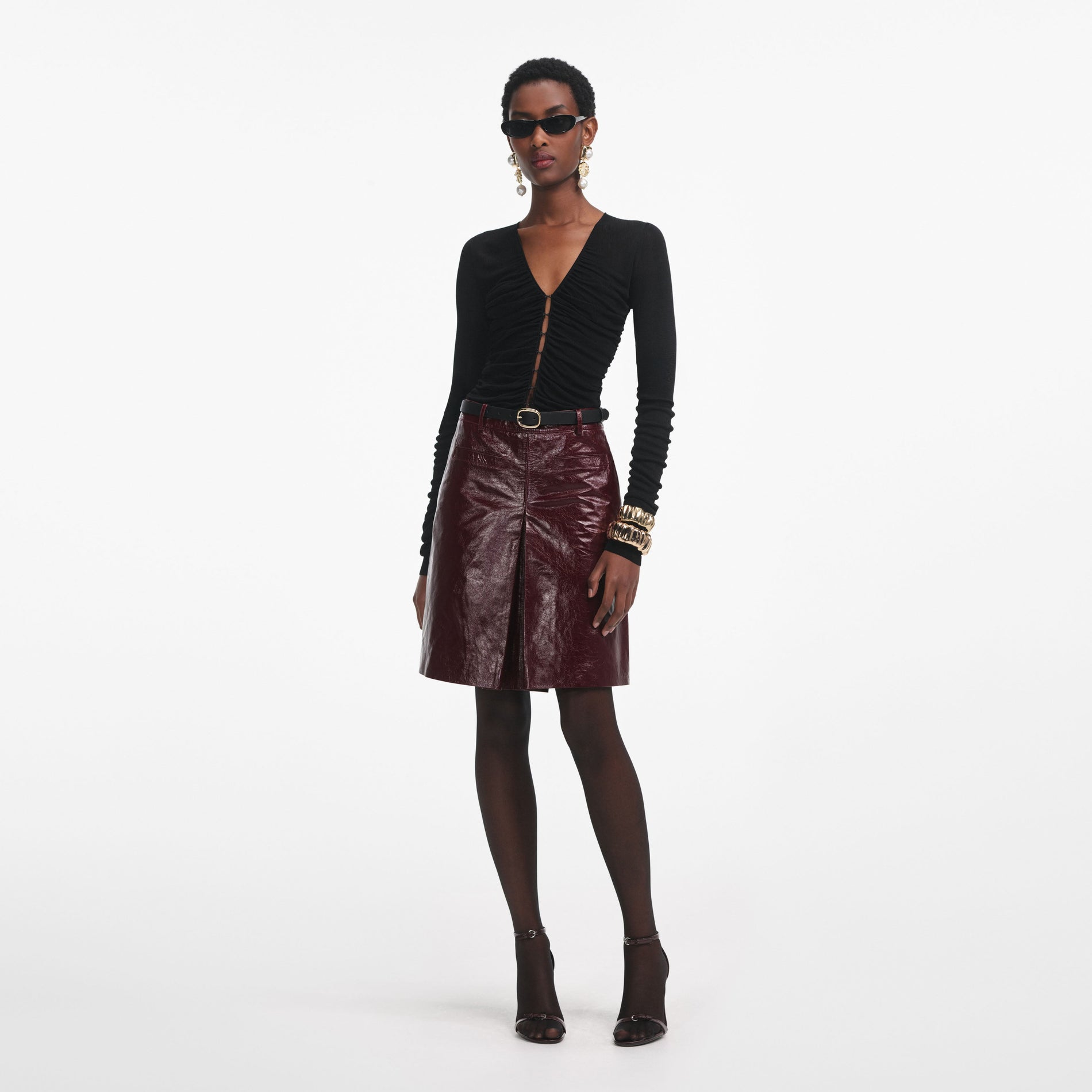 Front view of a woman wearing the Black Viscose Knit Top