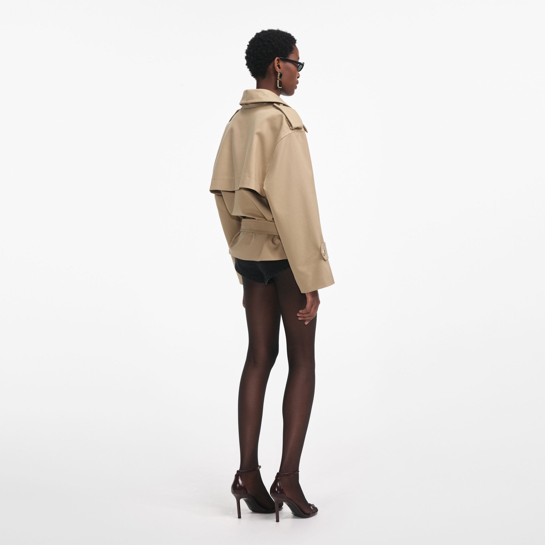 Back view of a woman wearing the Beige Trench Jacket