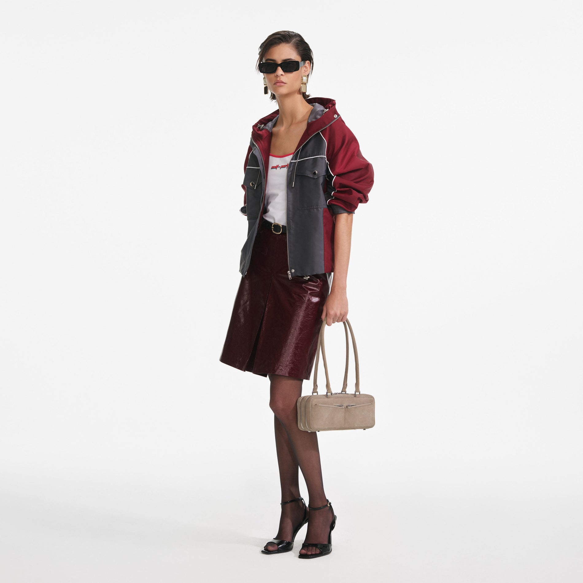 Side view of a woman wearing the Dark Grey Nylon Windbreaker