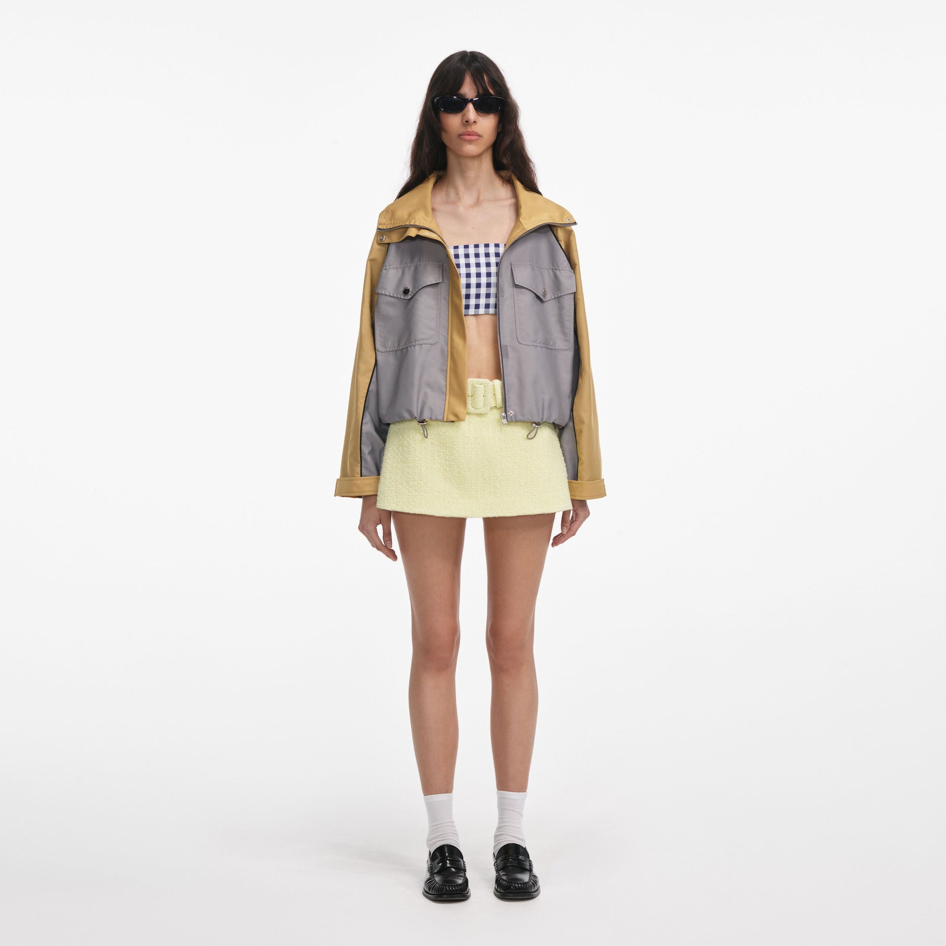 Front view of a woman wearing the Grey Nylon Cropped Windbreaker