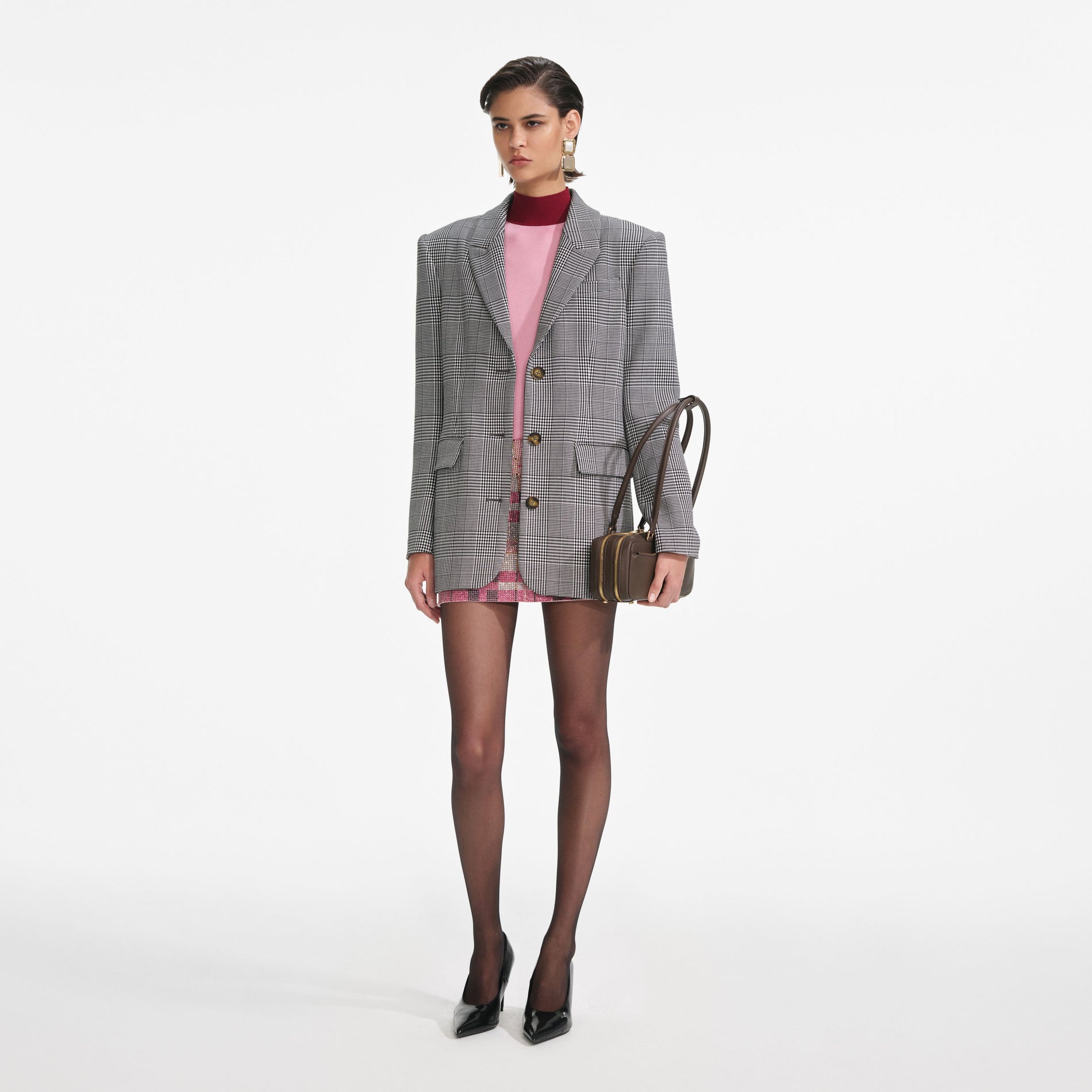 Side view of a woman wearing the Prince Of Wales Check Blazer