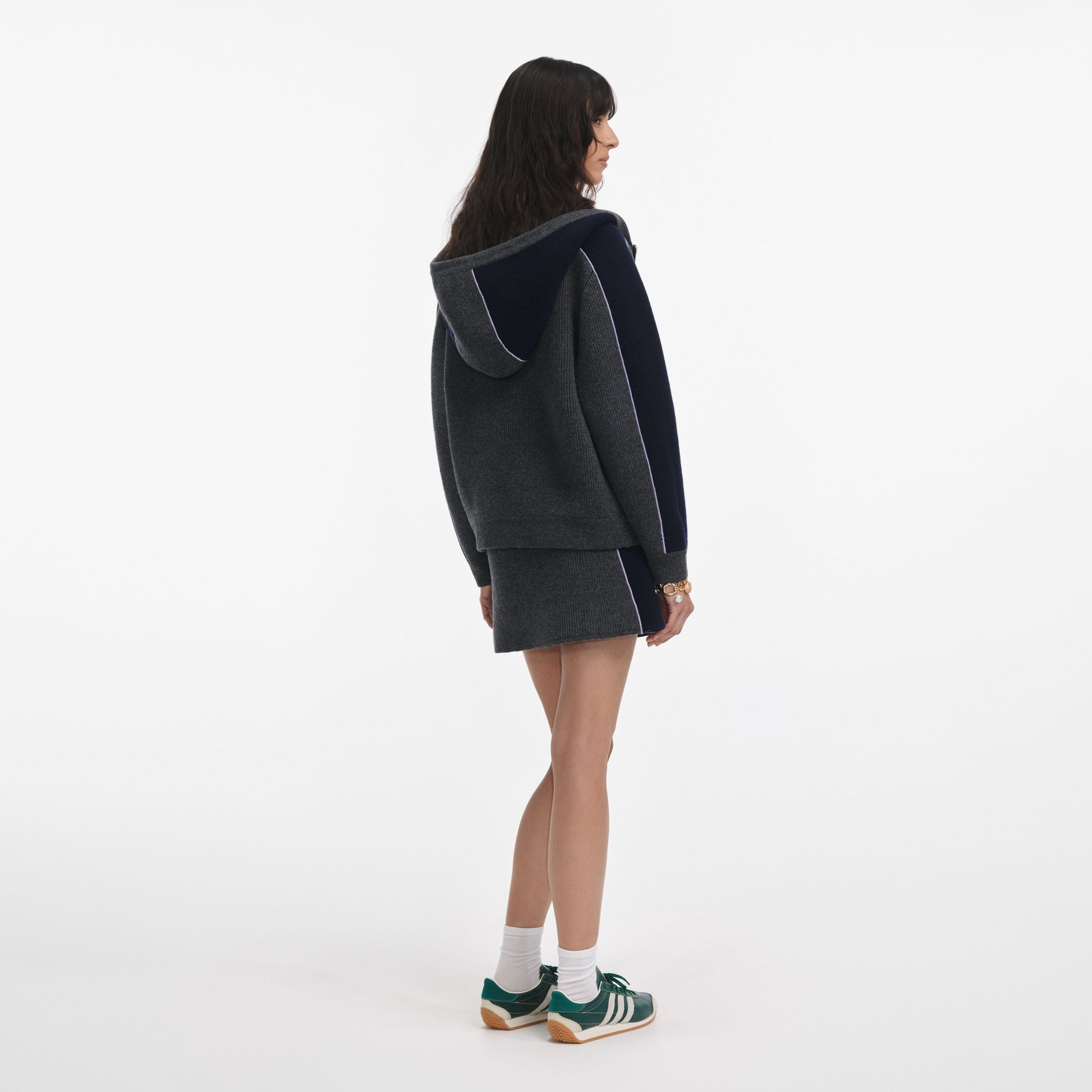 Back view of a woman wearing the Grey Ribbed Knit Mini Skirt